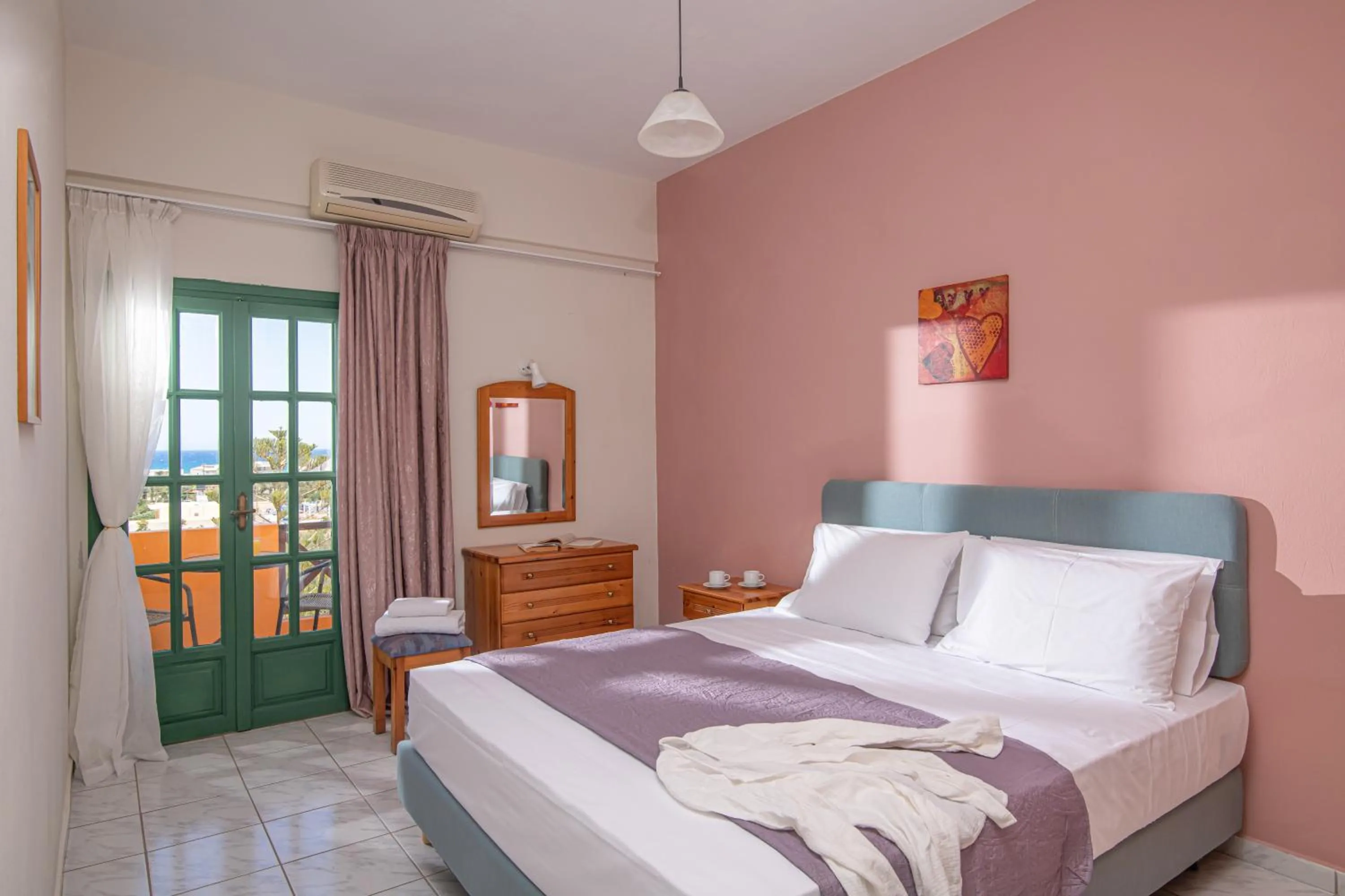 Bed in Portokali Apartments