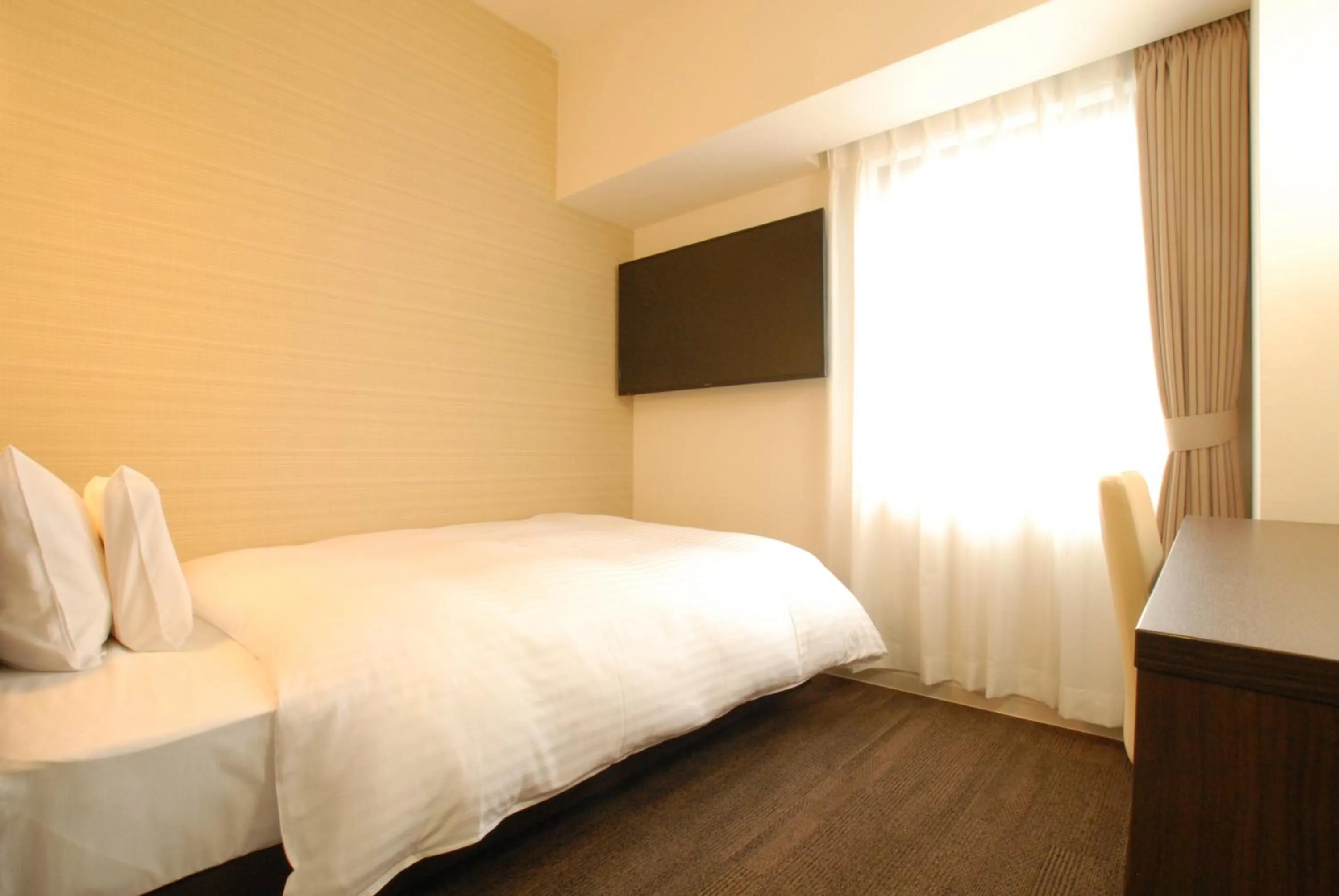 Bed in AB Hotel Iwata