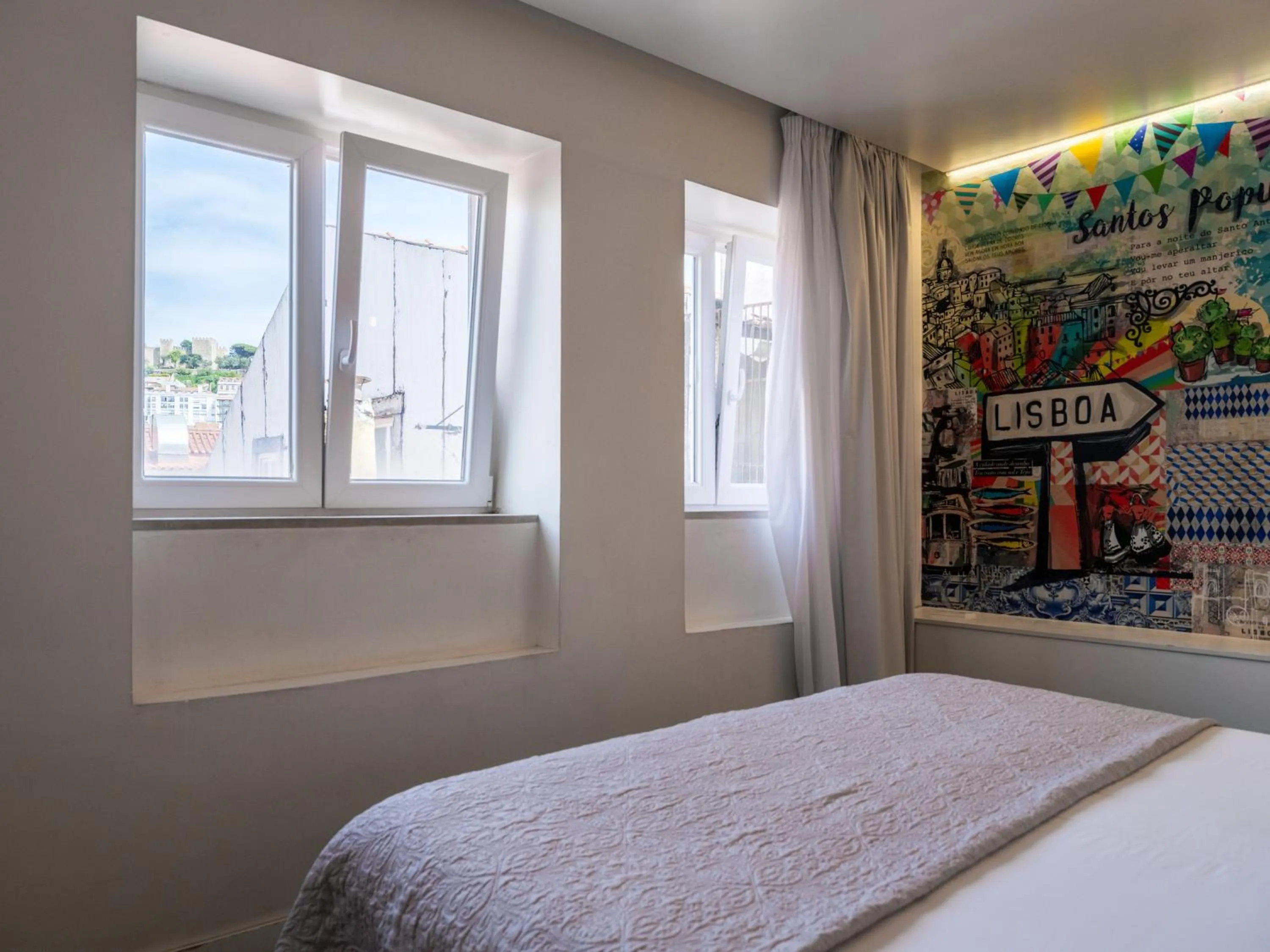 View (from property/room), Bed in The ART INN Lisbon