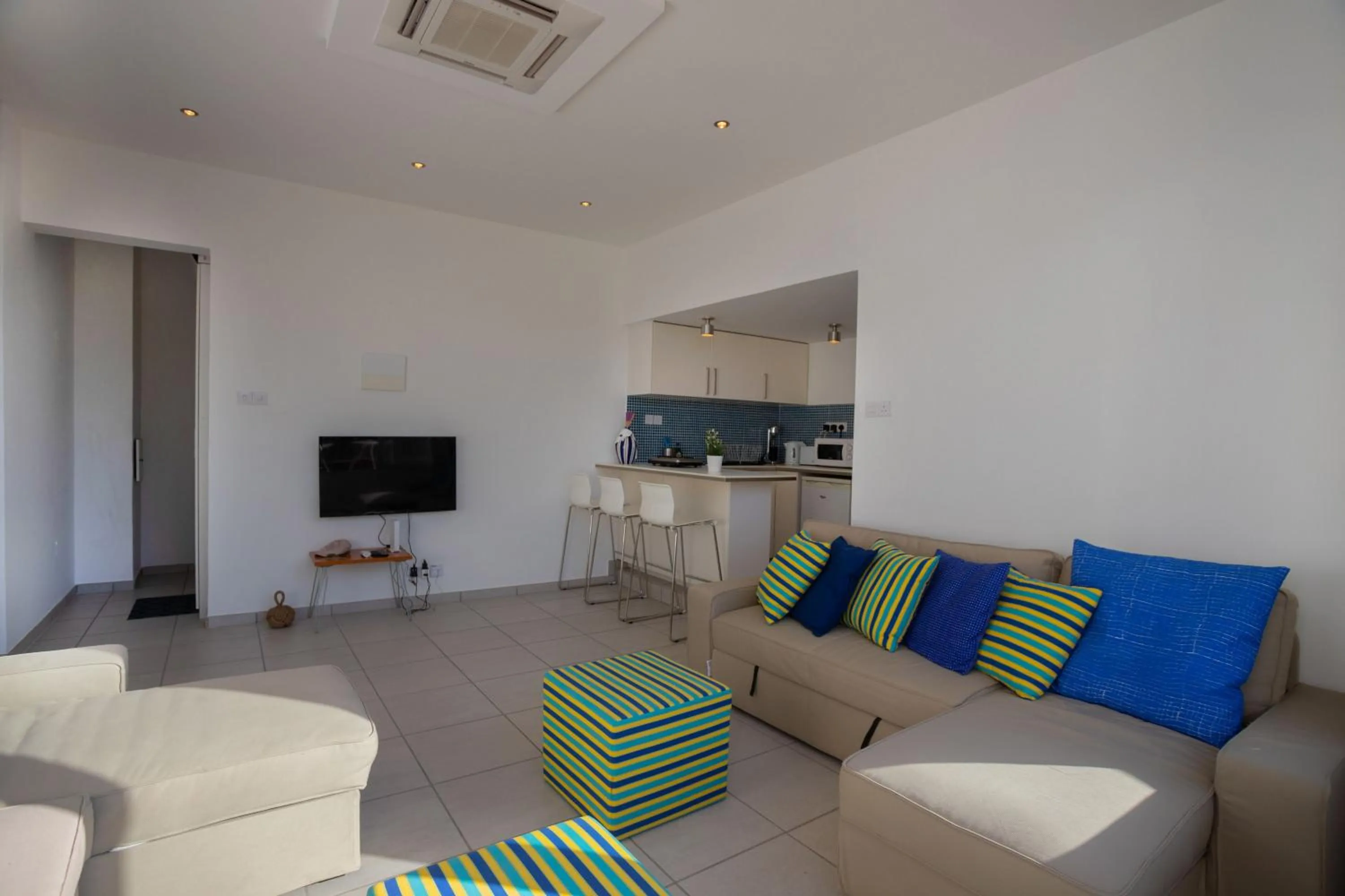 Living room in Athenaeum Beachside Apt by TrulyCyprus