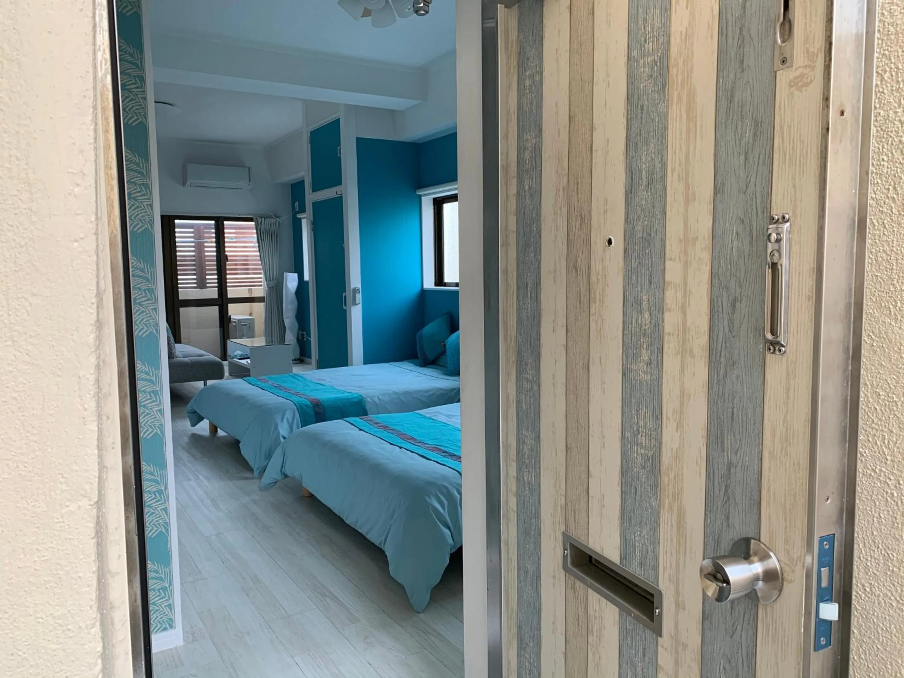 Bedroom, Bed in Maximum of 21 people can be rented in one building 3 minutes walk to Tomari Port 10 minutes drive to the airport No parking lot 30 seconds walk from paid parking lot warayunso port city May