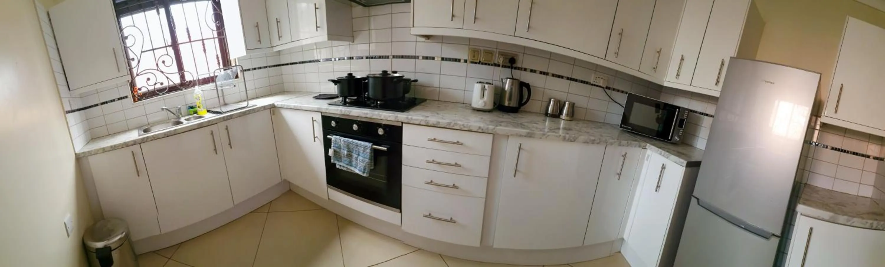 Kitchen or kitchenette in Eric Wilkins Apartments