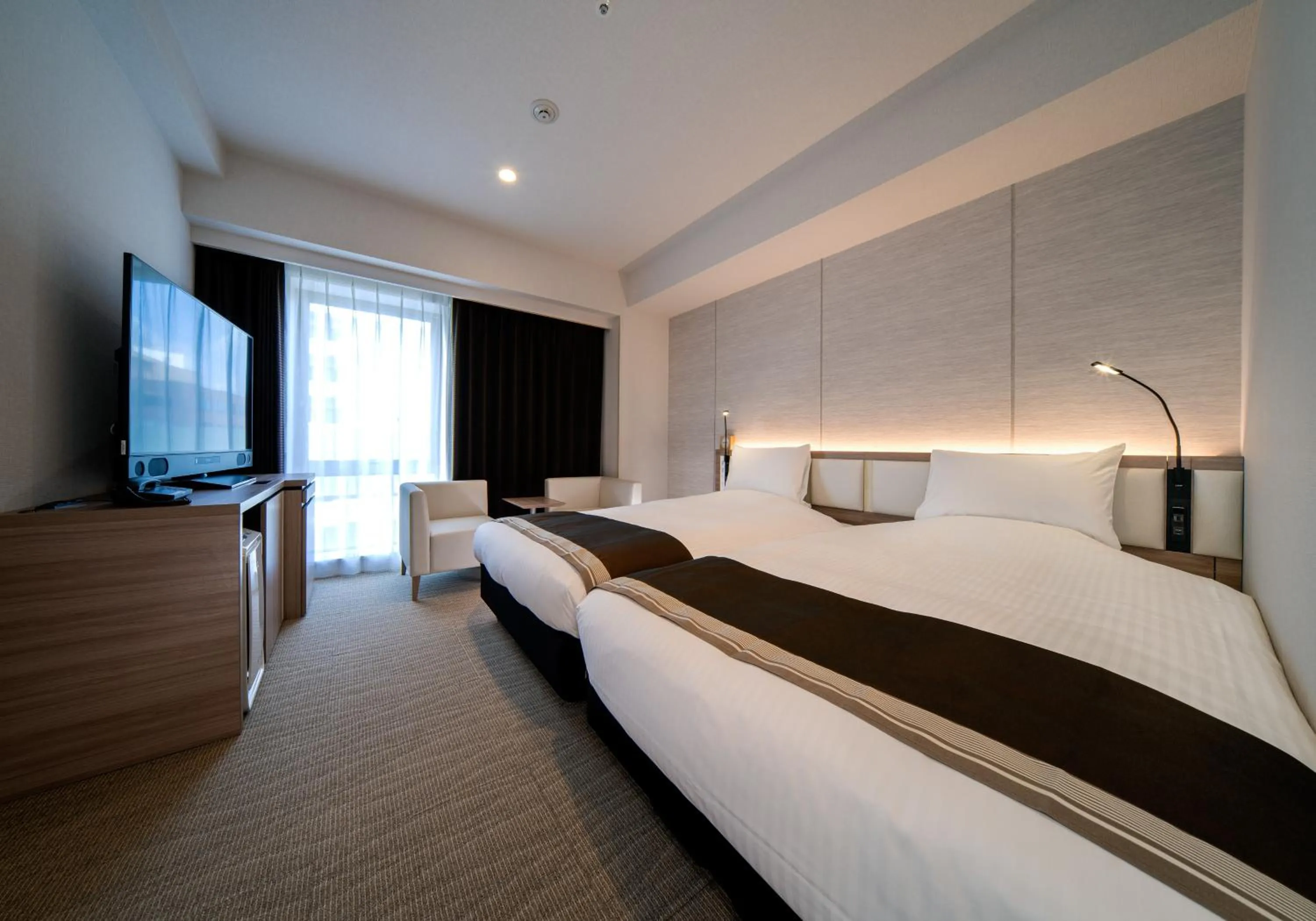 Photo of the whole room, Bed in Daiwa Roynet Hotel Okinawa-Kenchomae