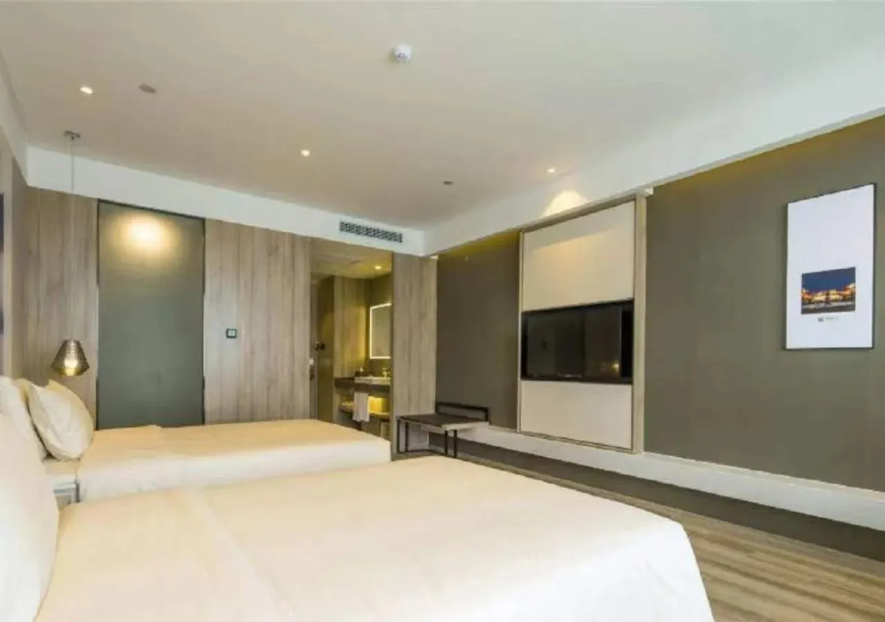 Bed in Atour Hotel Hangzhou Binjiang Jiangling Road