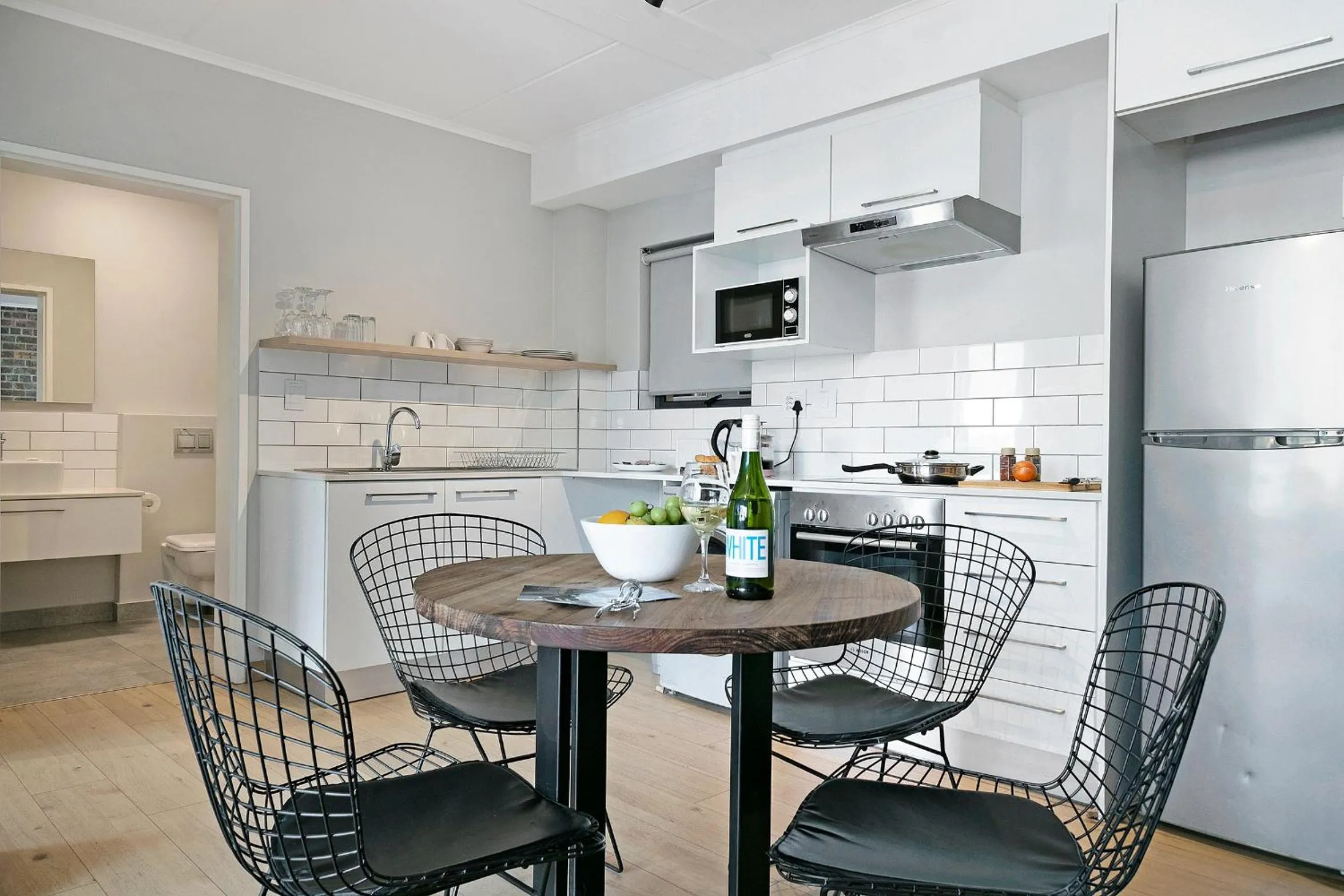 Dining area in Urban Artisan Luxury Suites by Totalstay