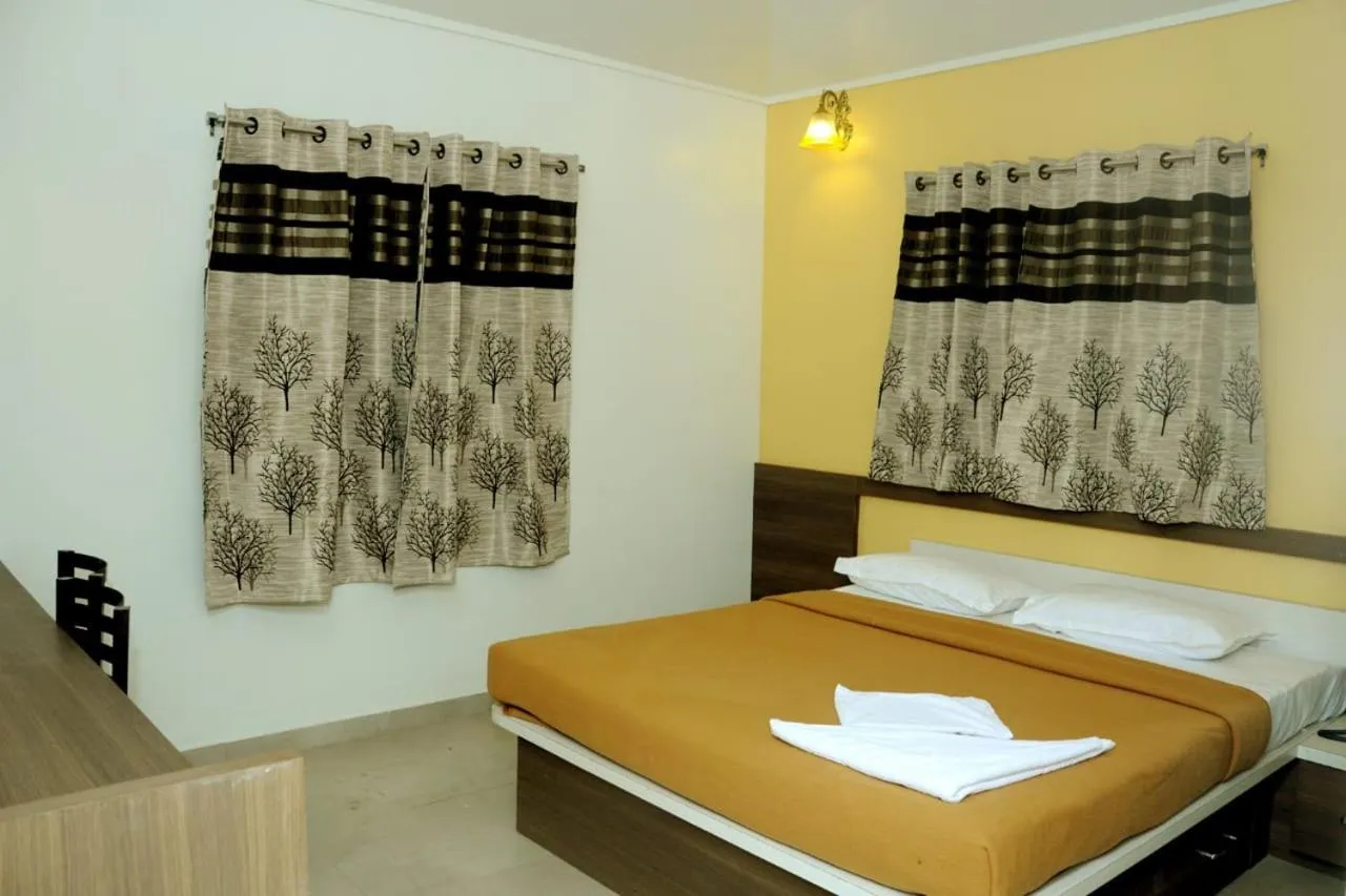 Bed in Rutu's Holidays Resort Panhala