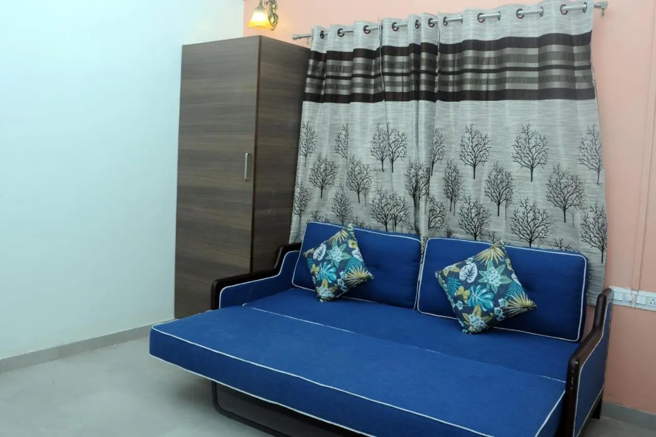 Seating area, Bed in Rutu's Holidays Resort Panhala