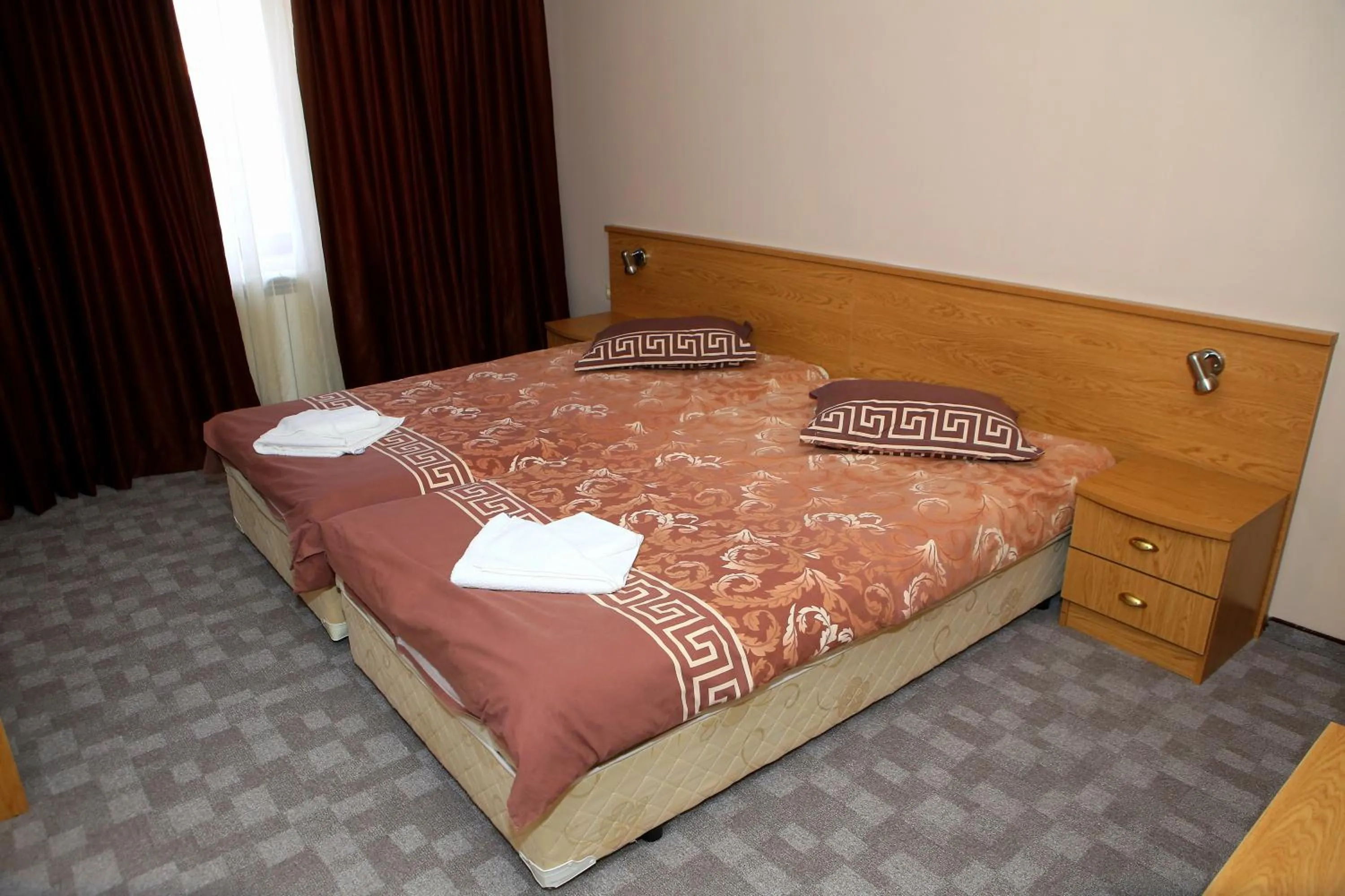 Shower, Bed in Family Prim Hotel