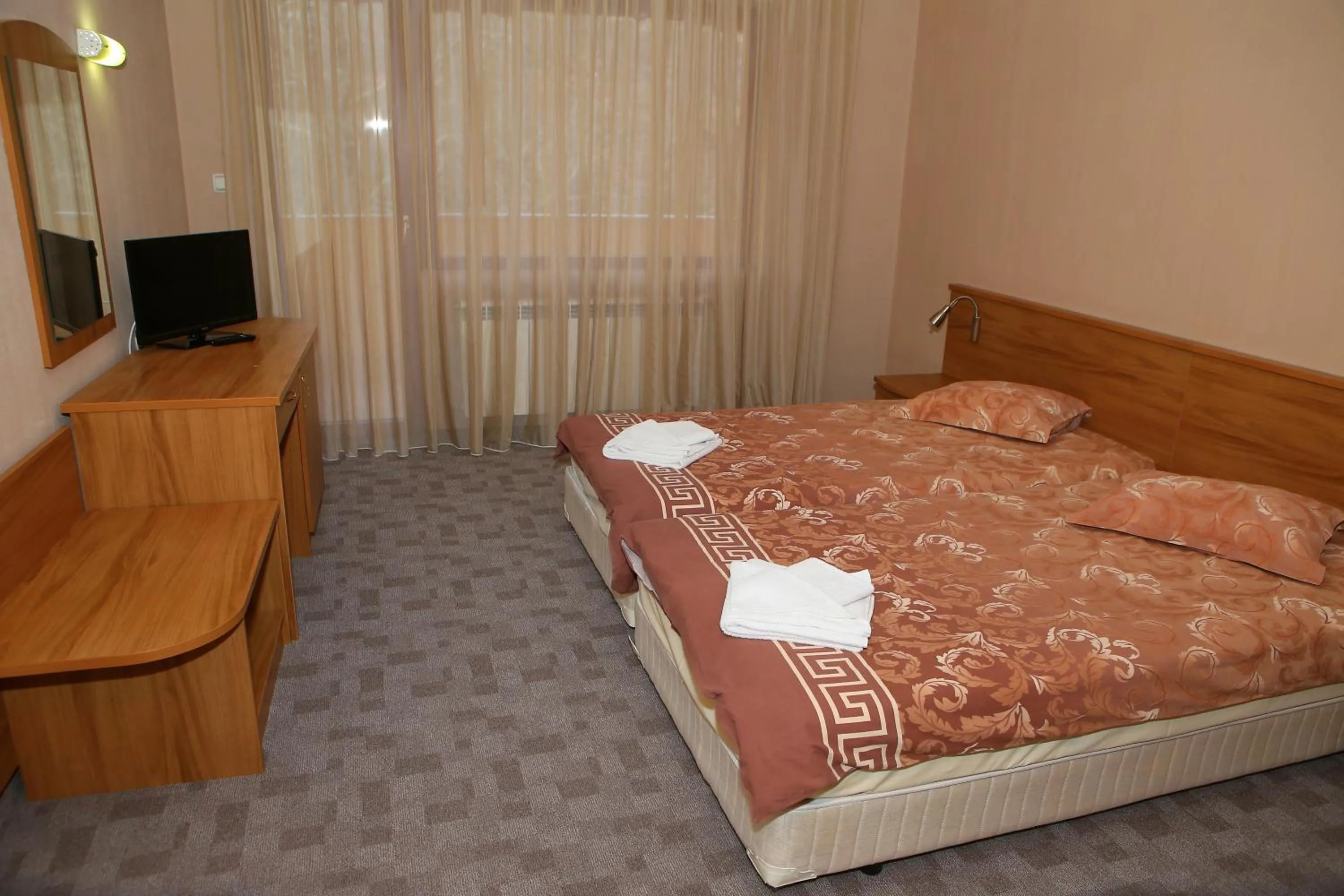 Shower, Bed in Family Prim Hotel