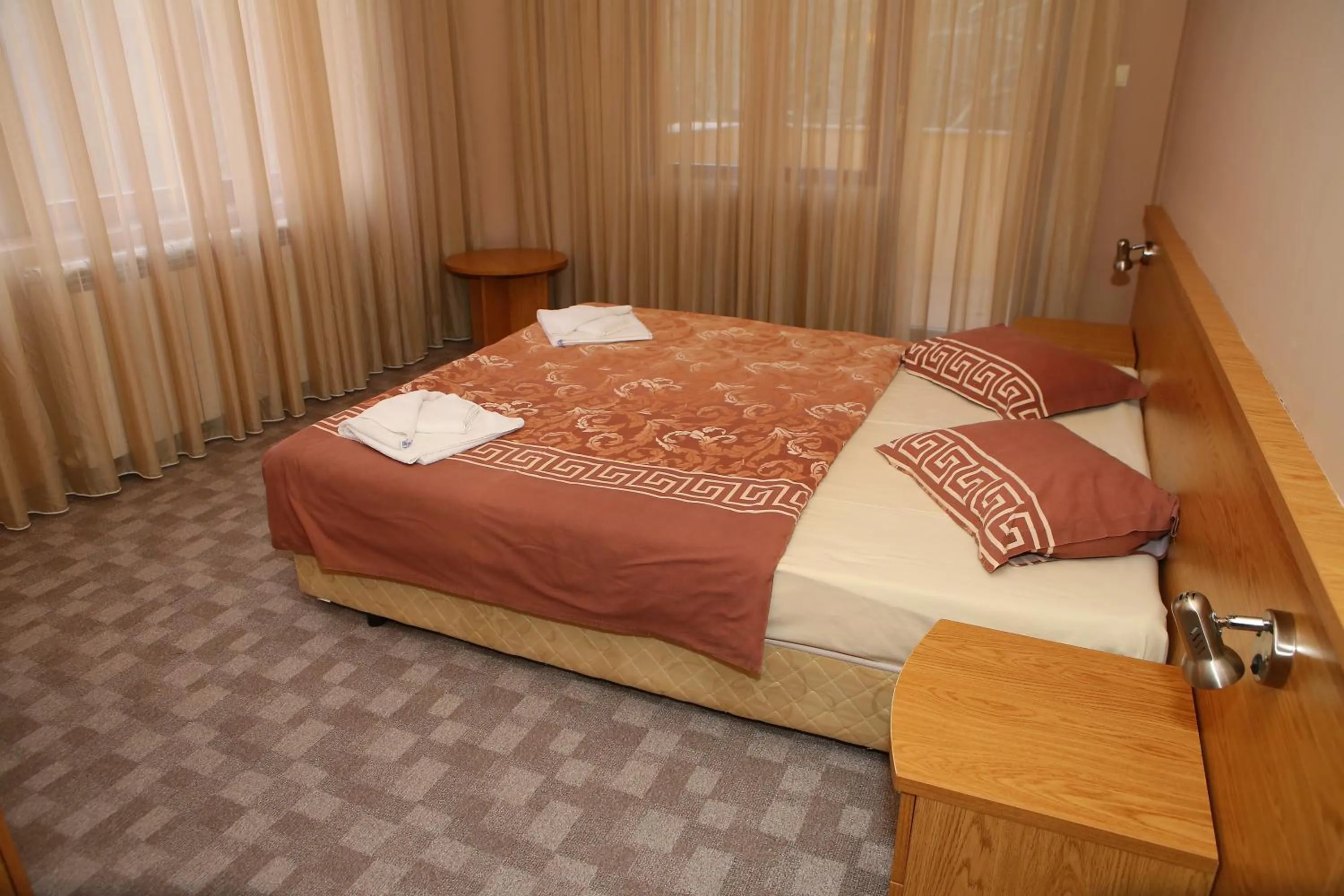 Shower, Bed in Family Prim Hotel