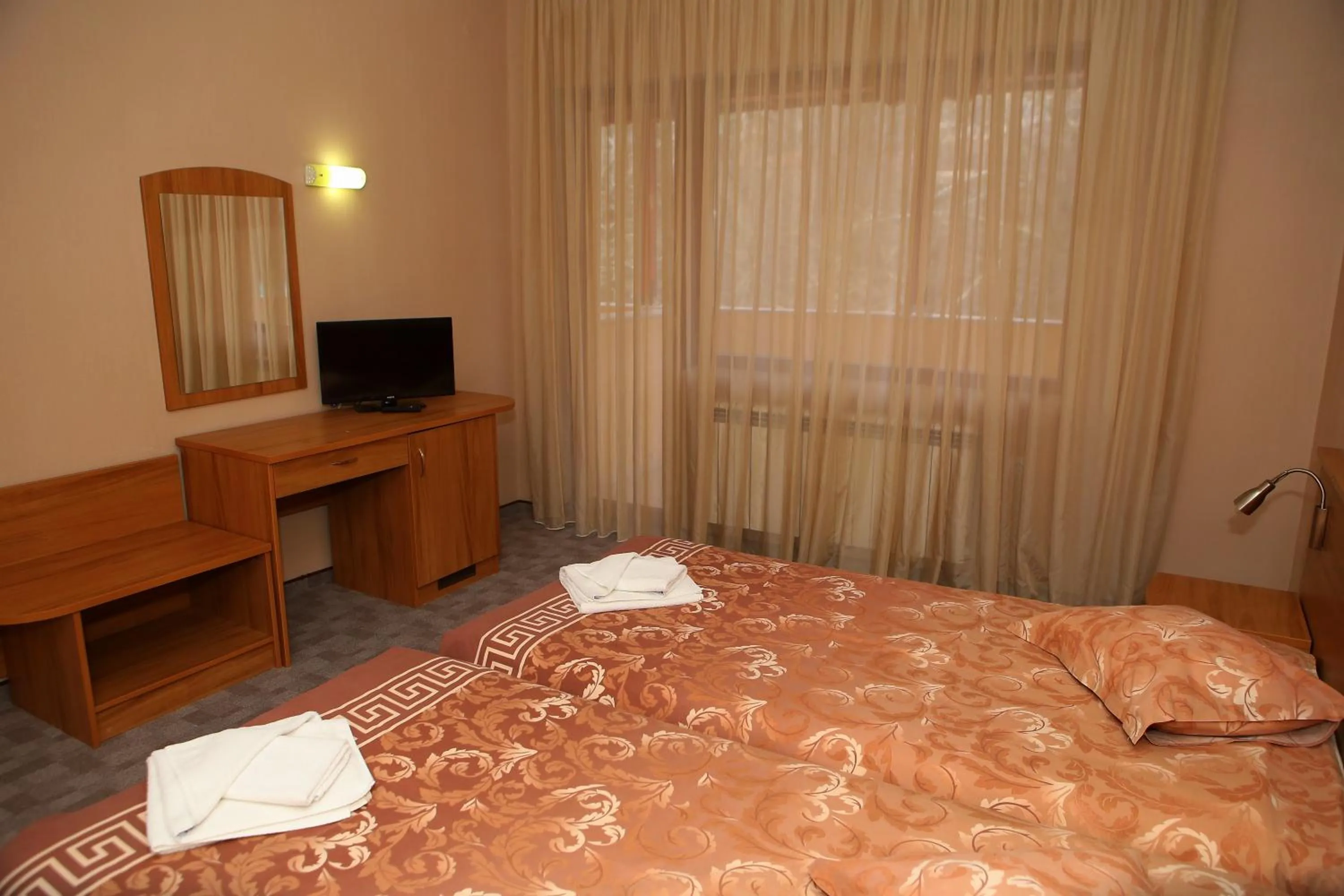 Shower, Bed in Family Prim Hotel