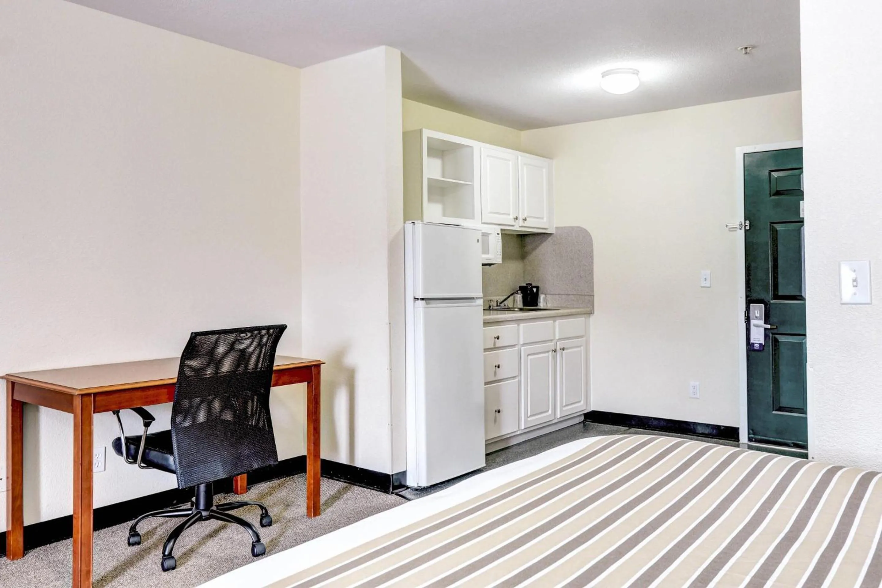 Bedroom in Suburban Studios Westminster Denver North