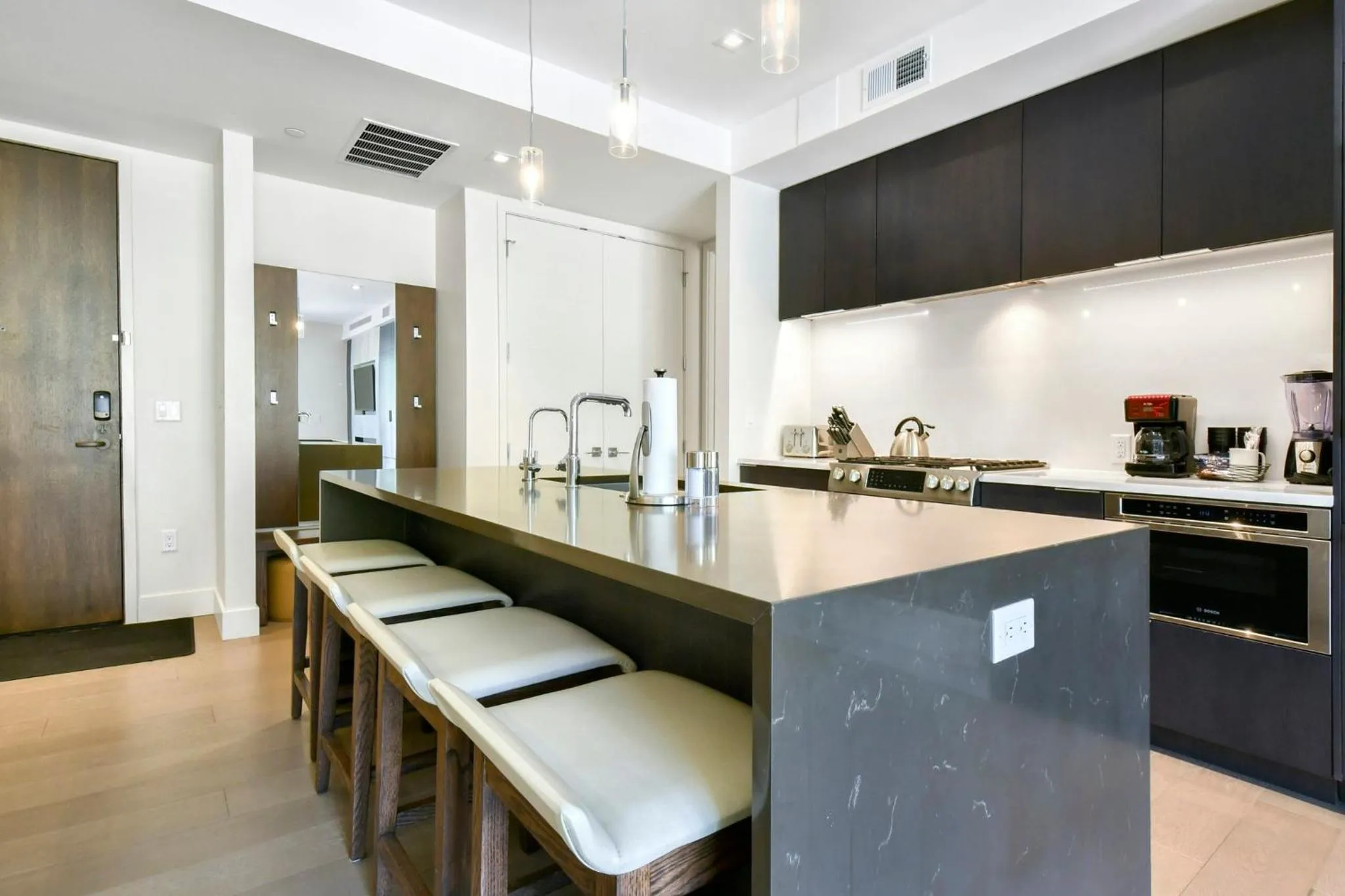 Communal kitchen in Lift Park City Condominiums by Vail Resorts