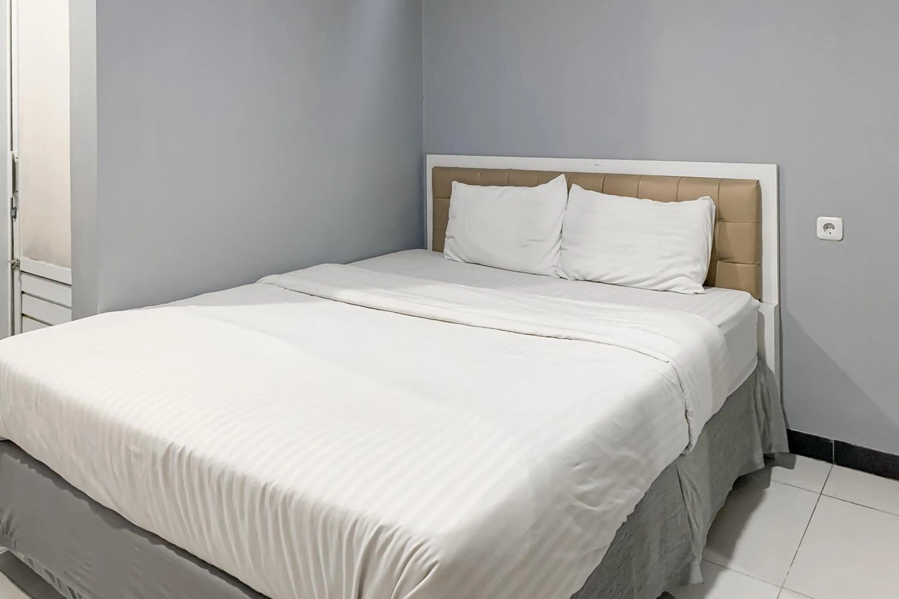 Bed in Karins Guesthouse Syariah RedPartner