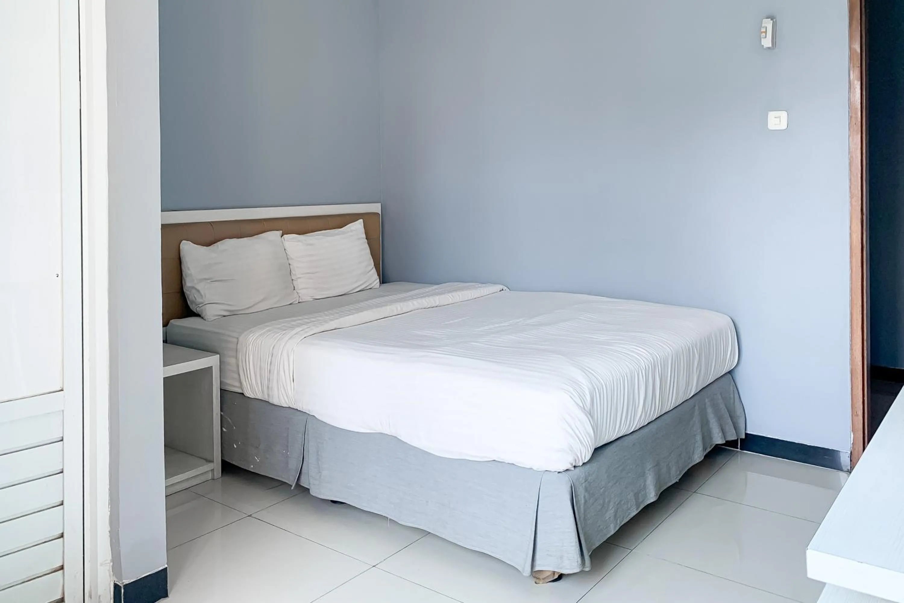 Bed in Karins Guesthouse Syariah RedPartner