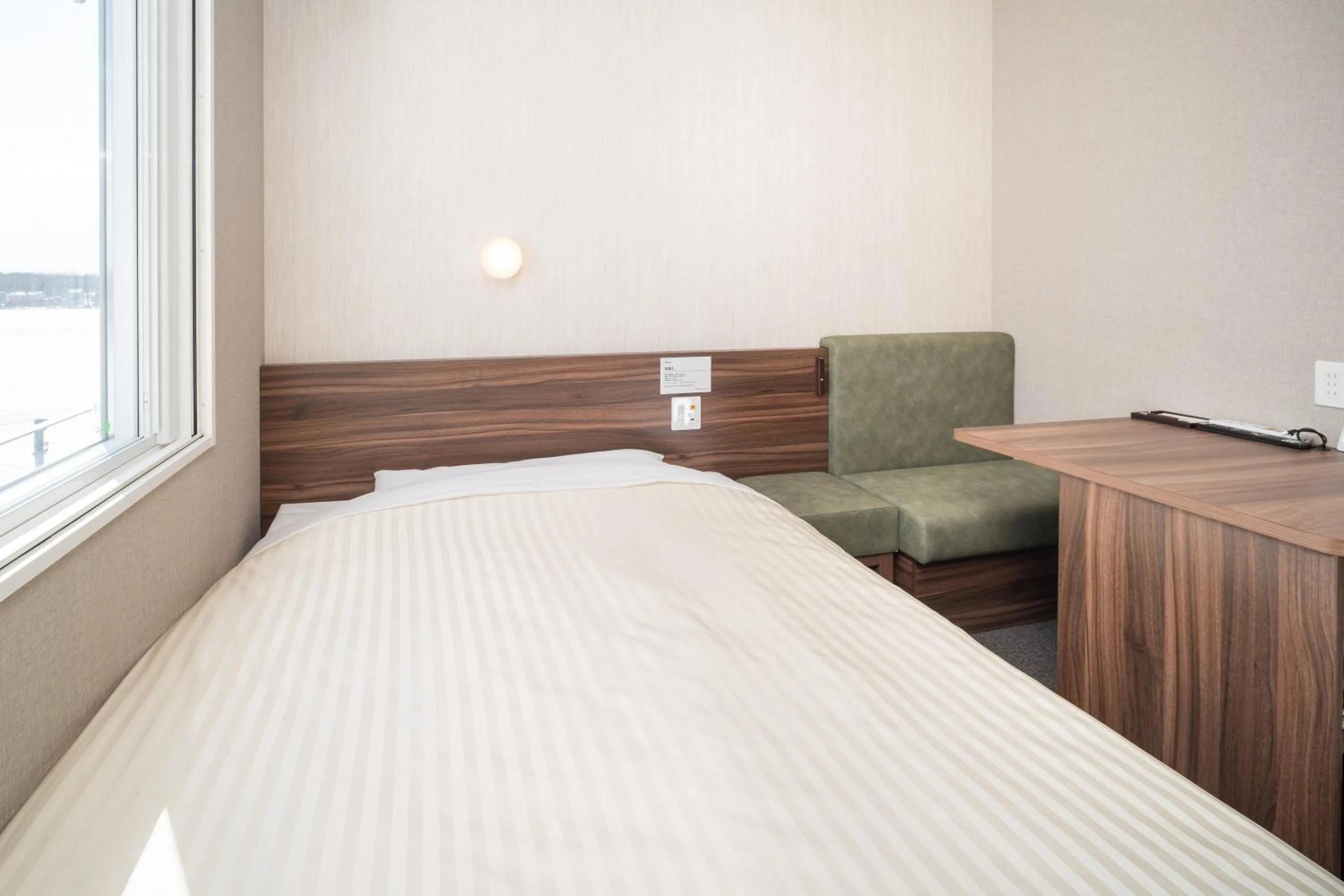 Bedroom in Super Hotel Ishikari