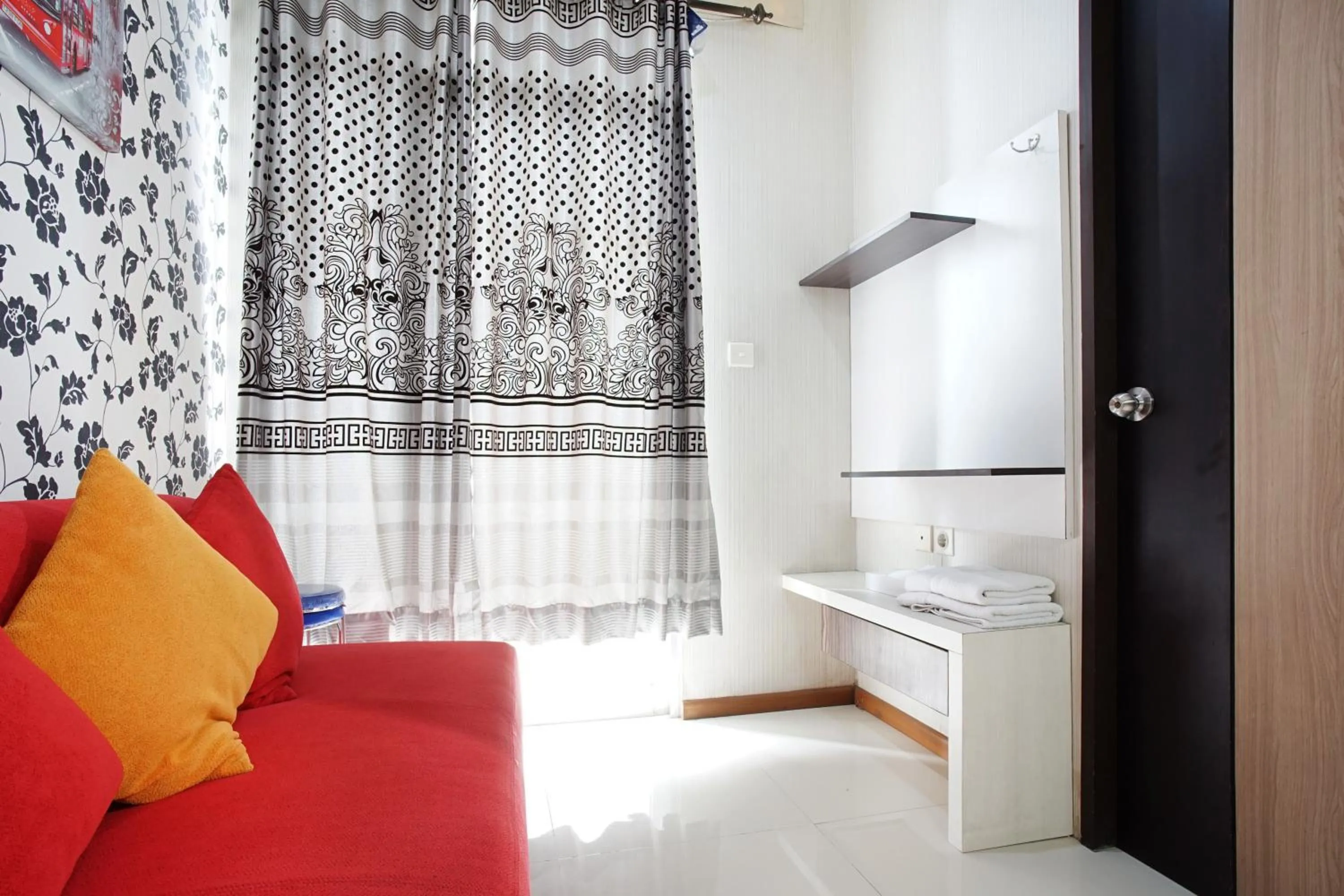 Living room, Bed in Kamarku Apartment at The Edge