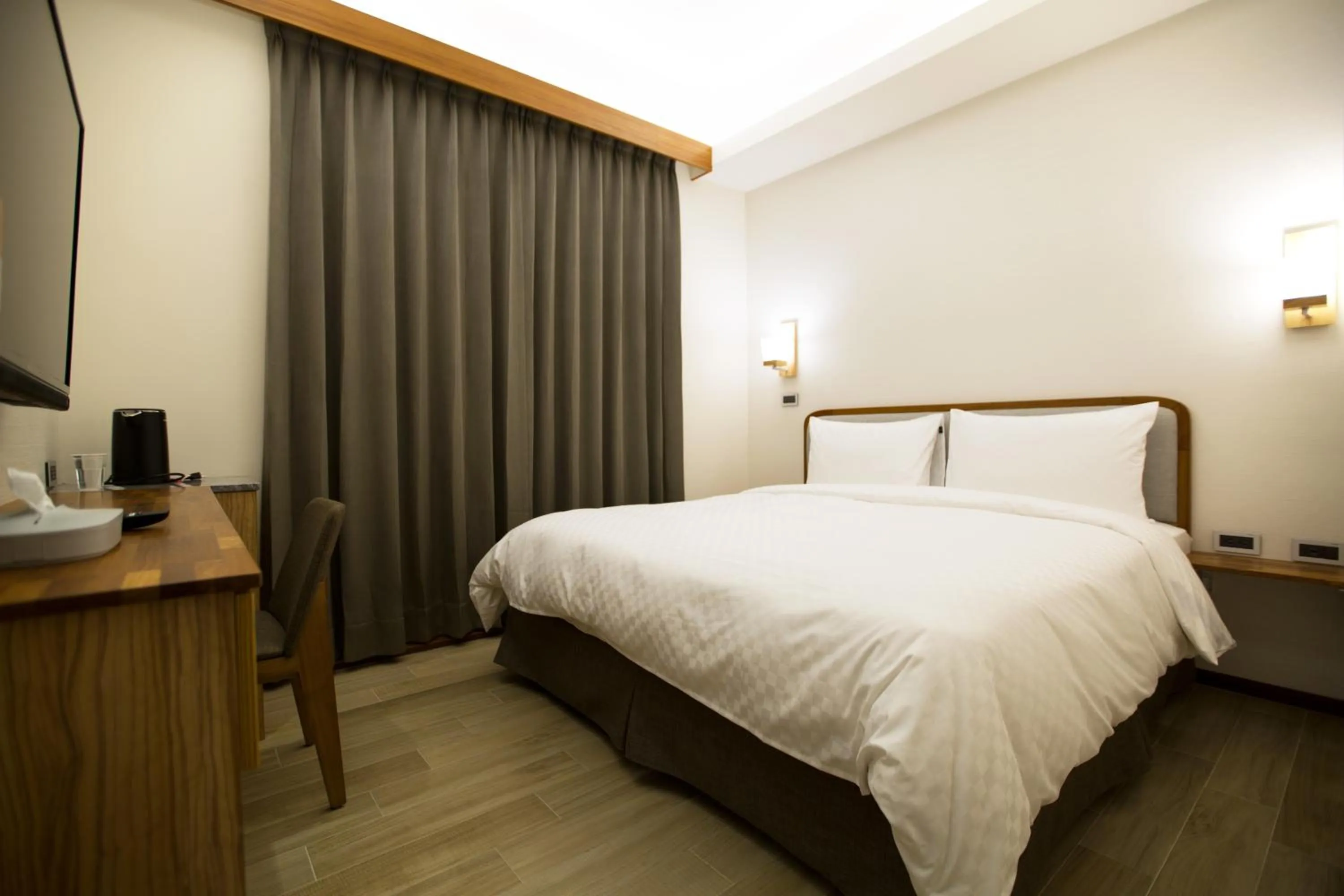 Bed in 原鄉商旅 Yuan Hsiang Hotel