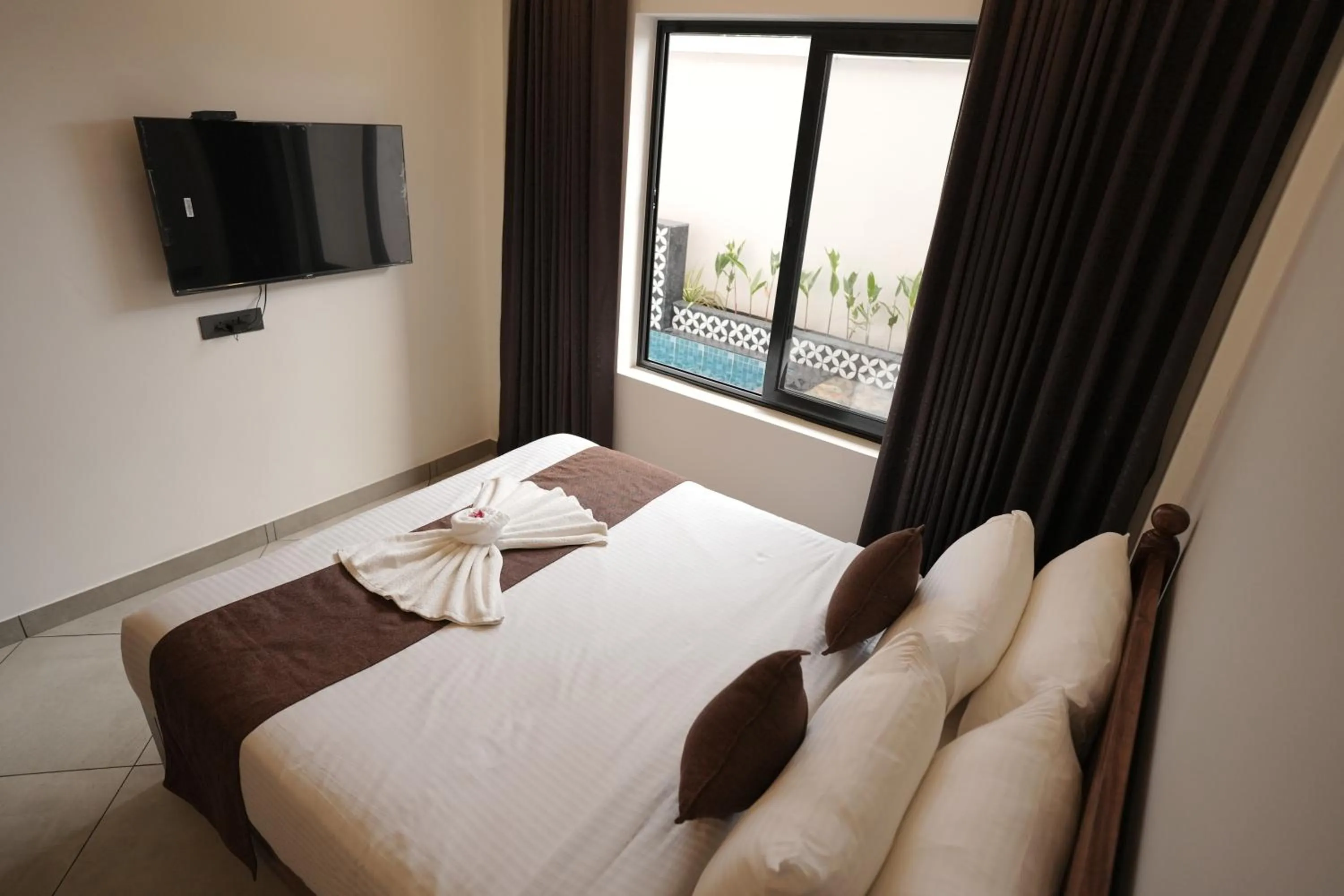 Bed in Aadisaktthi Leisure Resort, Kovalam