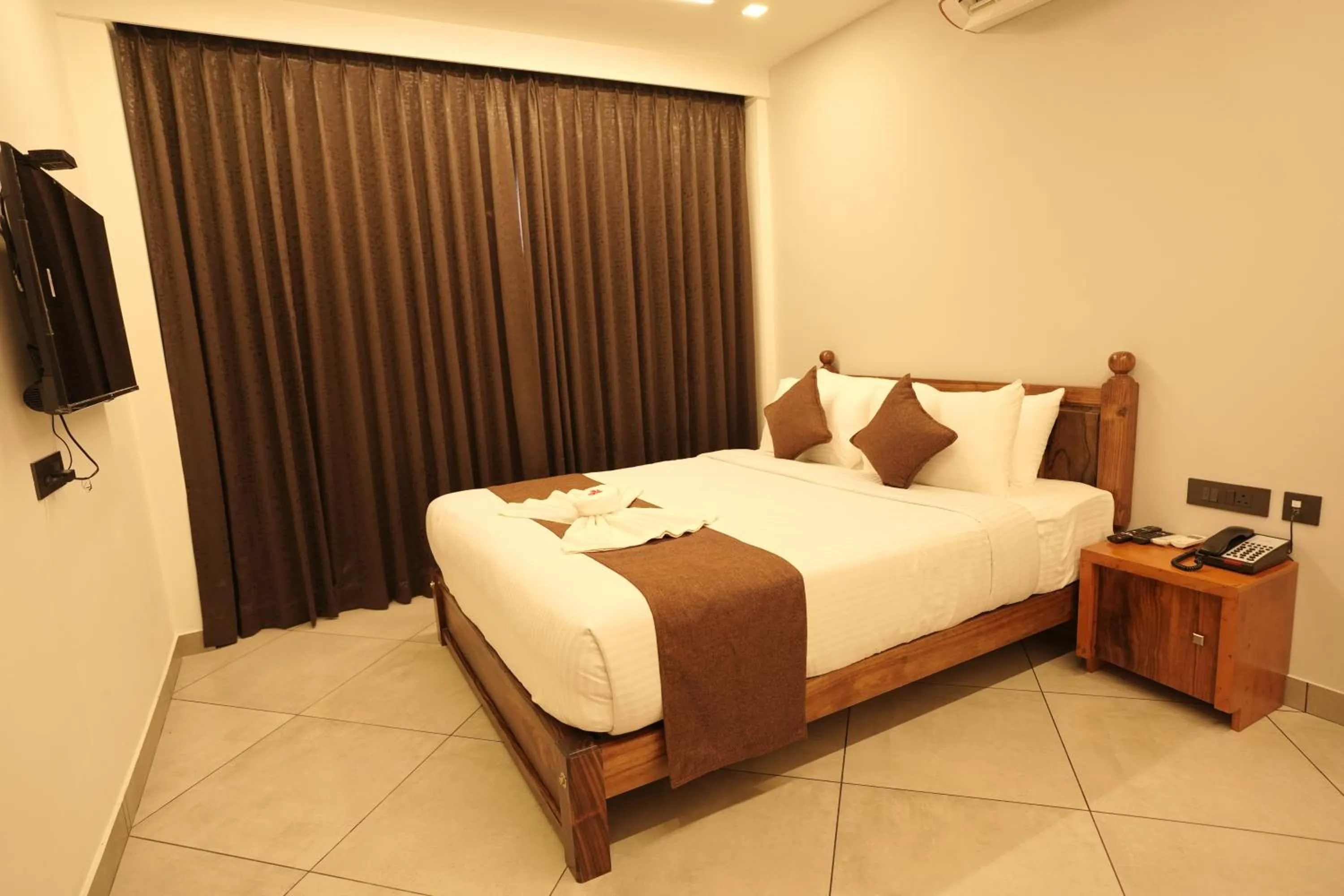 Bed in Aadisaktthi Leisure Resort, Kovalam