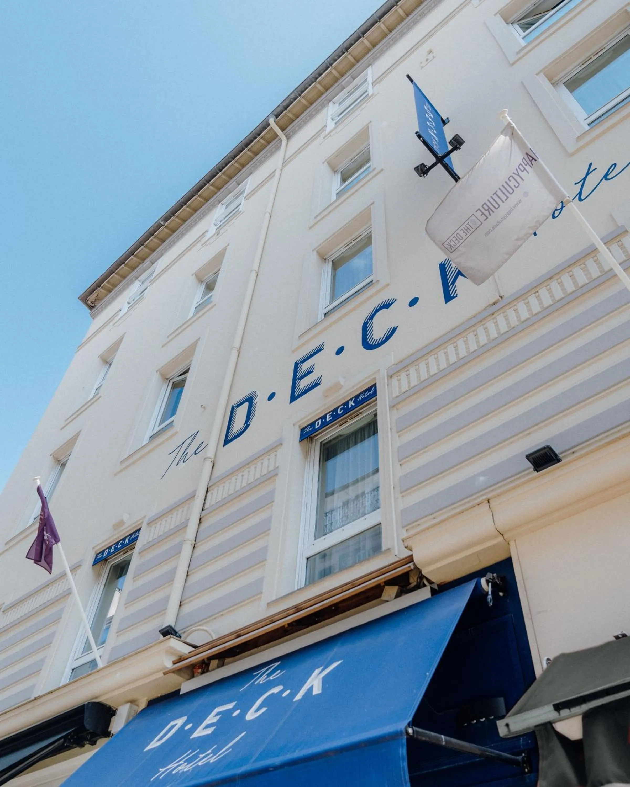 Property building in The Deck Hotel by Happyculture