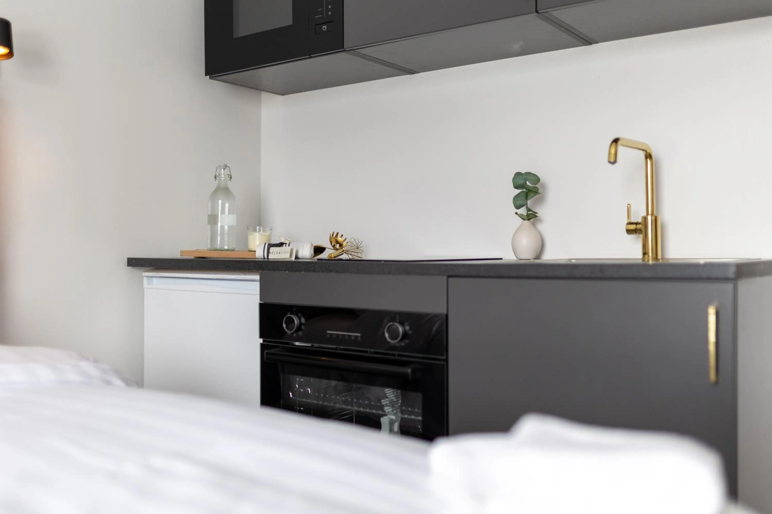 Kitchen or kitchenette, Bed in Halmstad Hotel Apartments