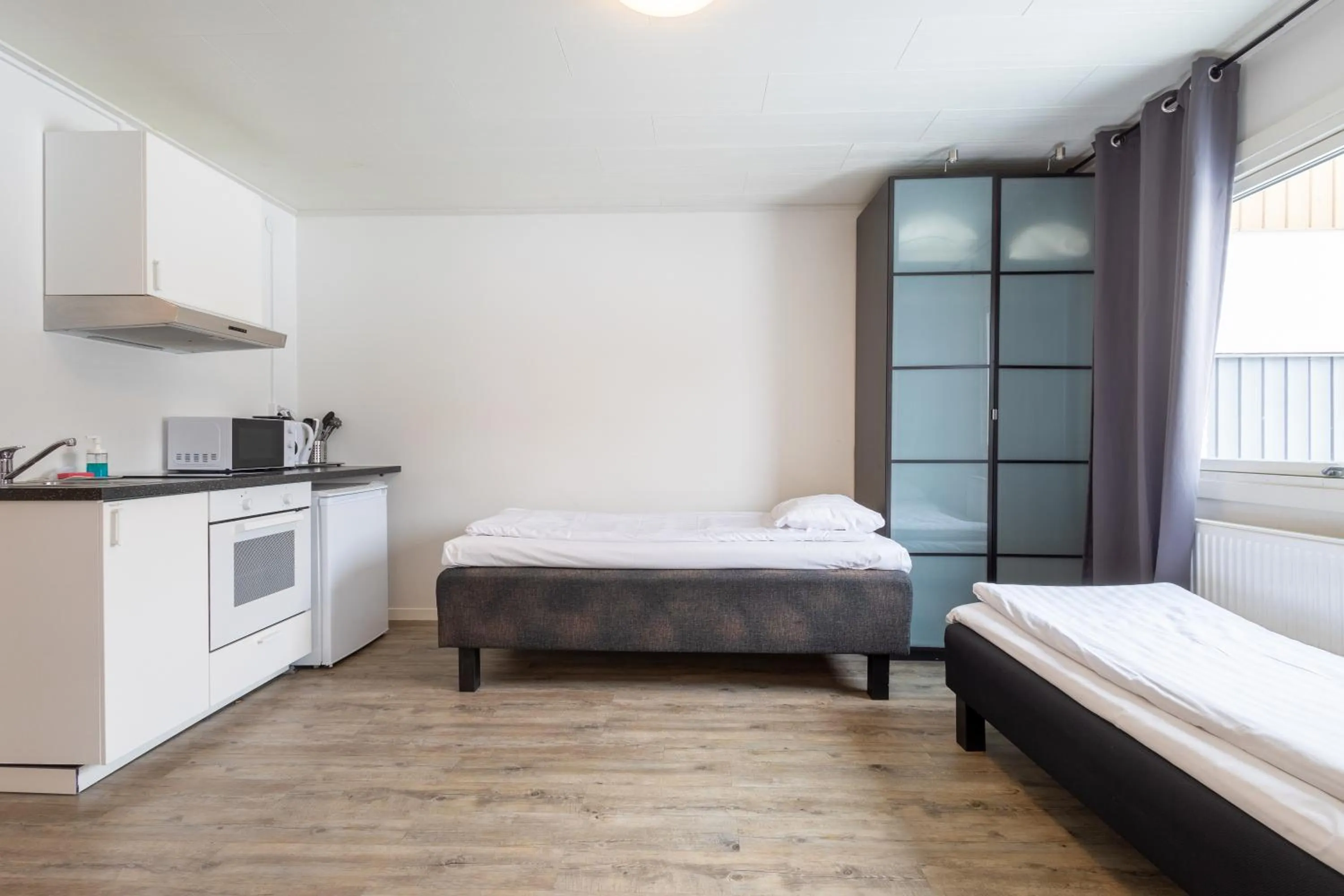 Kitchen or kitchenette, Bed in Halmstad Hotel Apartments