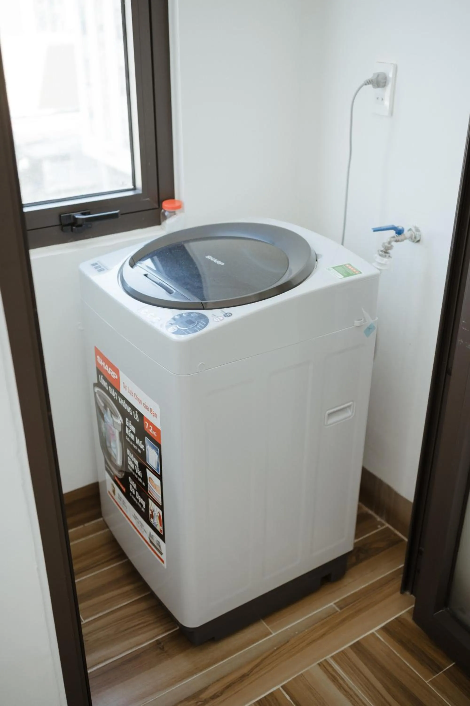 washing machine in THE NAVIS Hotel & Apartment