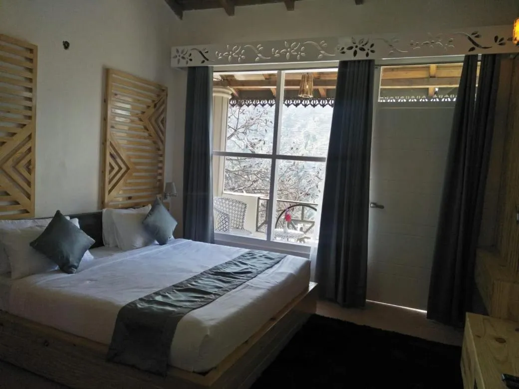 Bed in Clarks Exotica Resort Ramgarh Mukteshwar