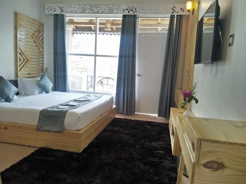 Bed in Clarks Exotica Resort Ramgarh Mukteshwar