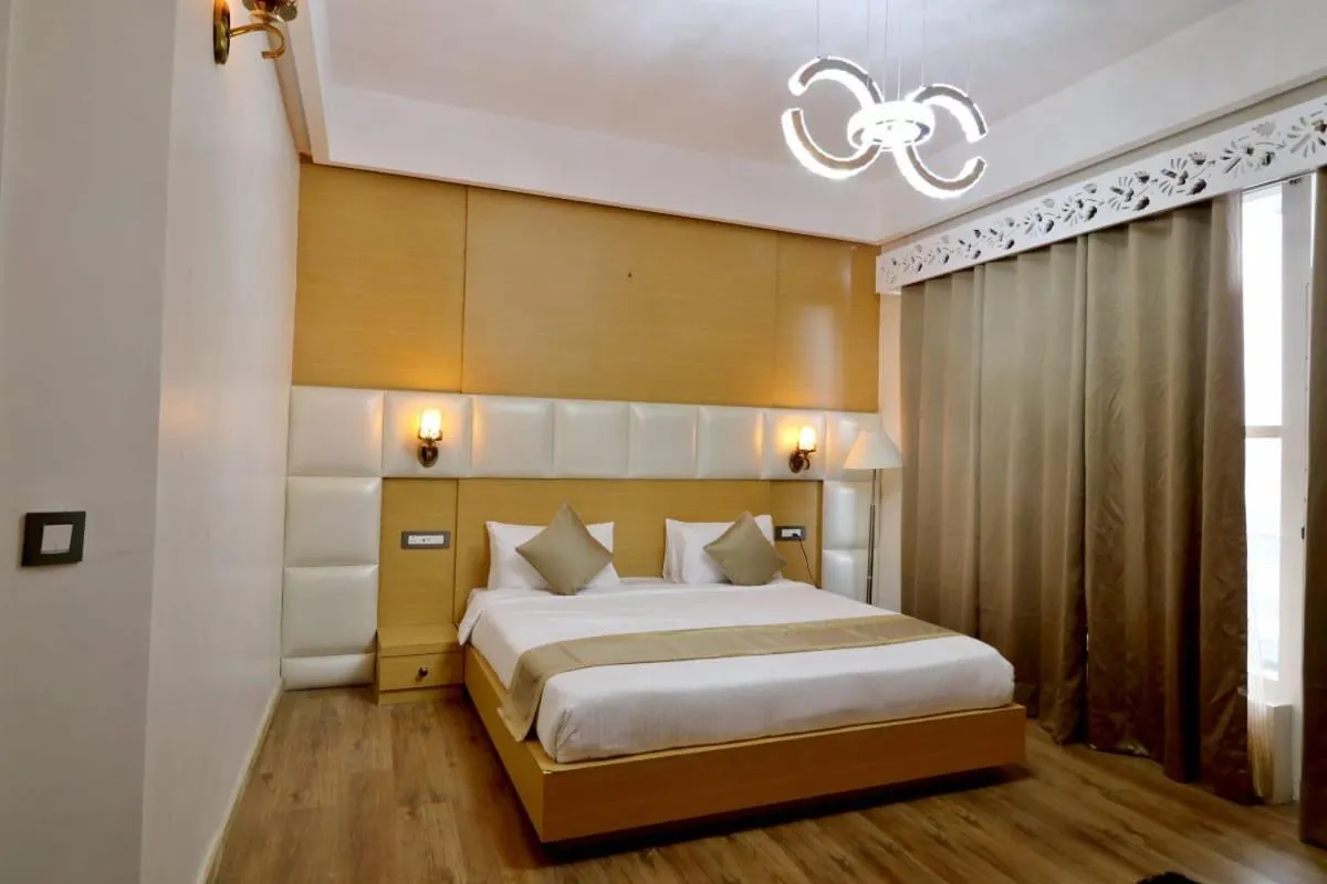 Bed in Clarks Exotica Resort Ramgarh Mukteshwar