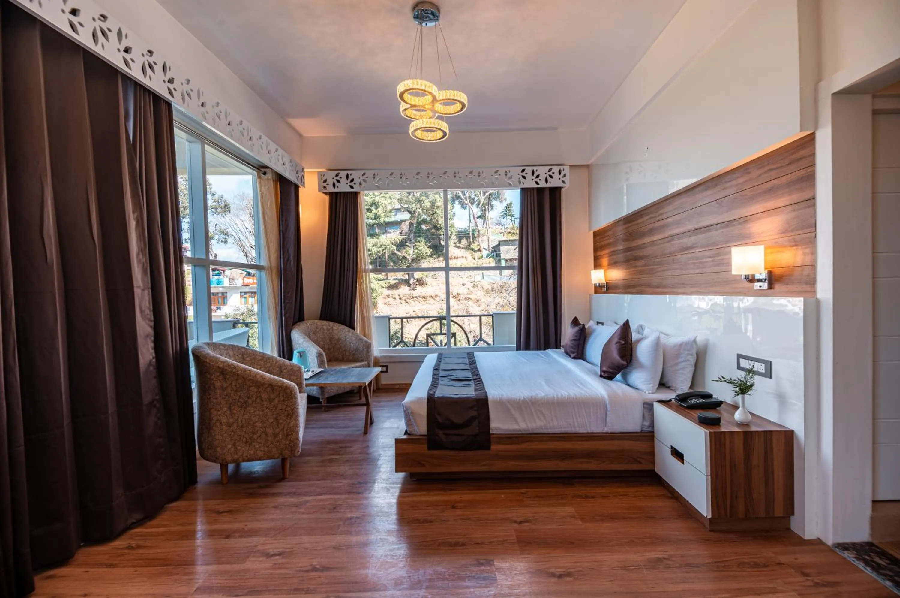 Living room, Bed in Clarks Exotica Resort Ramgarh Mukteshwar