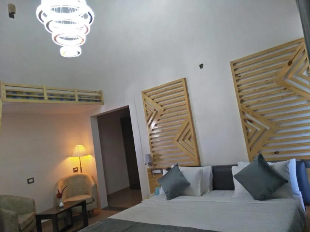 Bed in Clarks Exotica Resort Ramgarh Mukteshwar
