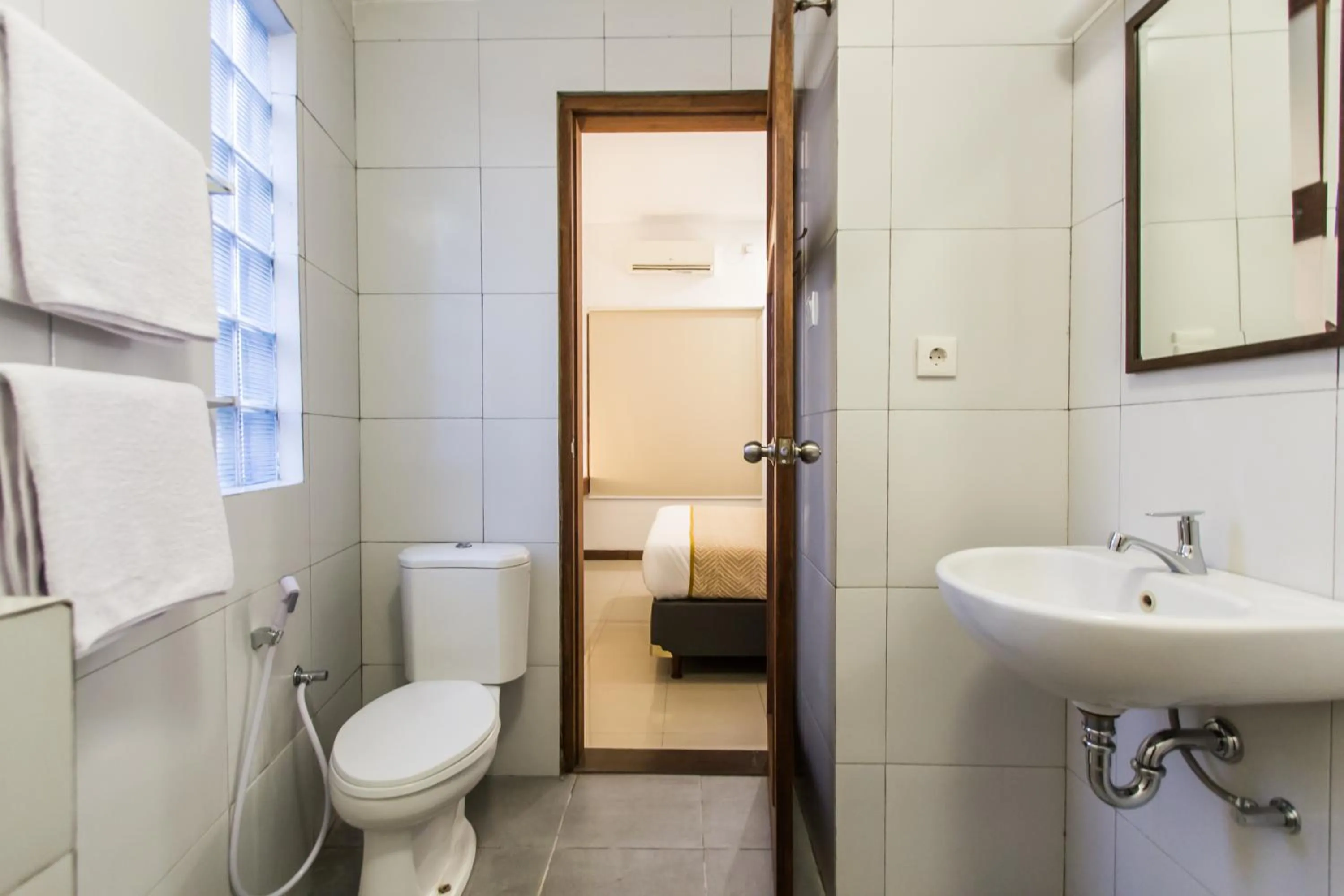 Bathroom in Kuta Legian Villa by Kamara