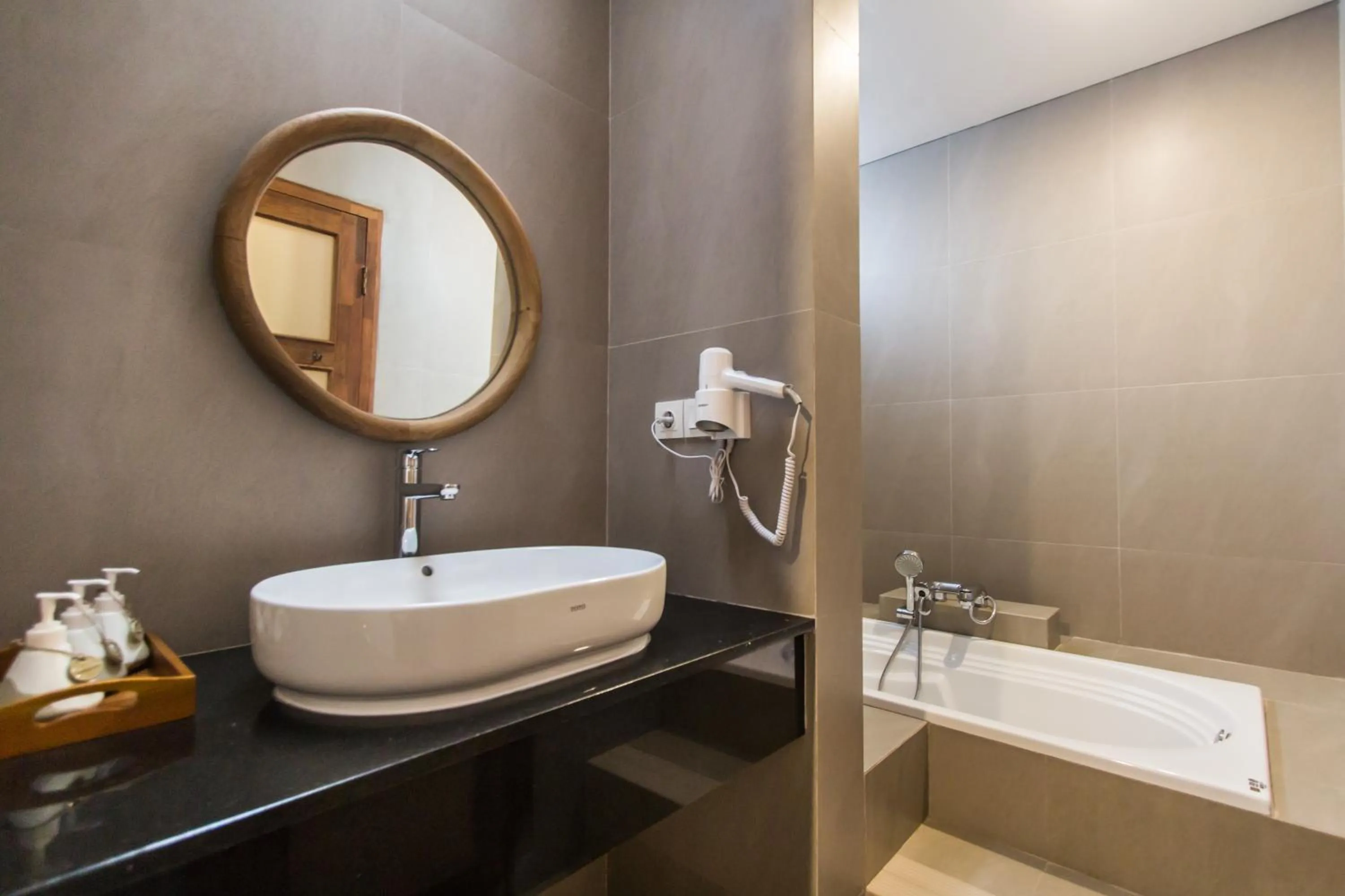 Bathroom in Kuta Legian Villa by Kamara