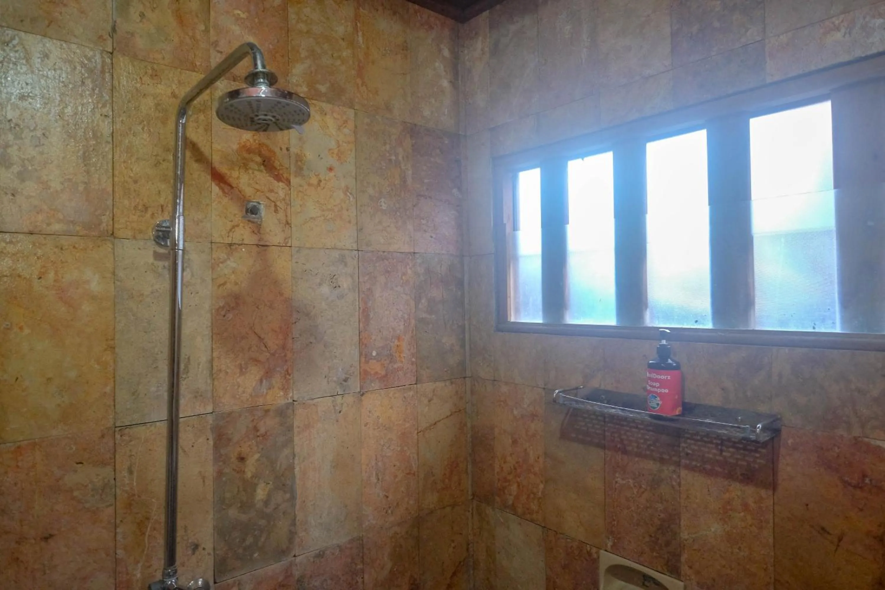 Bathroom in RedDoorz at Omah Kayu Homestay Yogyakarta
