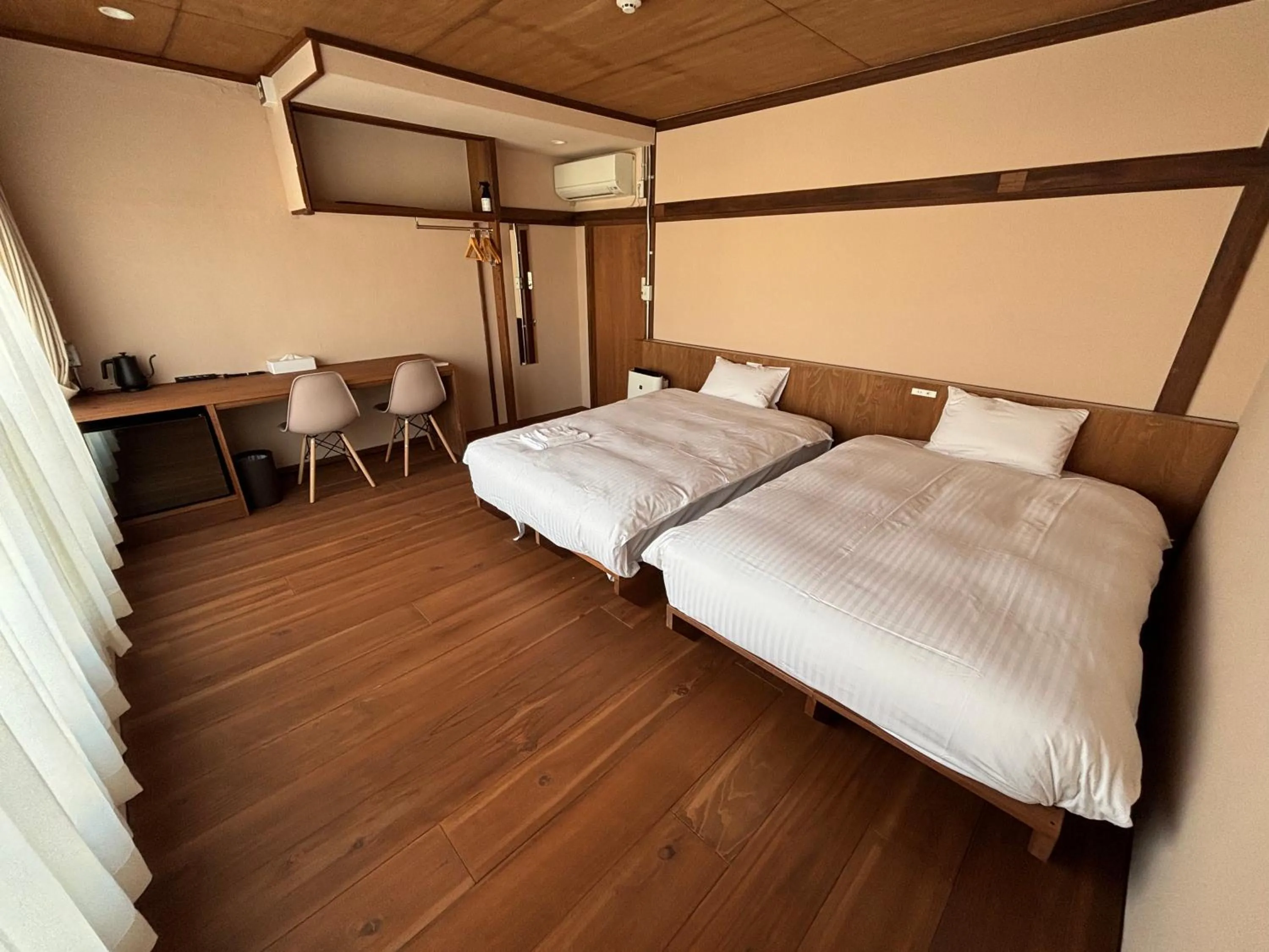 Bed in nirasakiyaSTAY