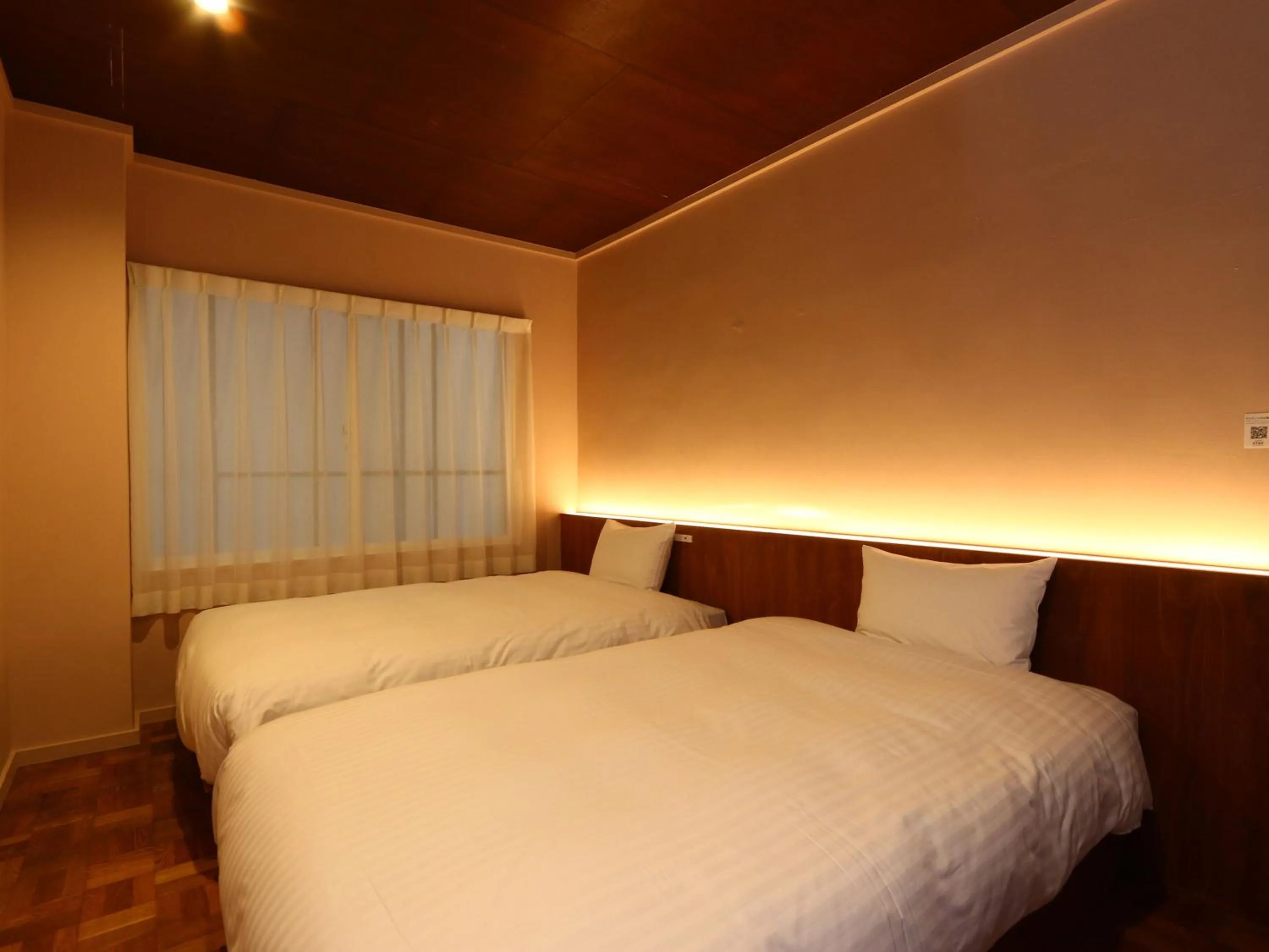 Bed in nirasakiyaSTAY