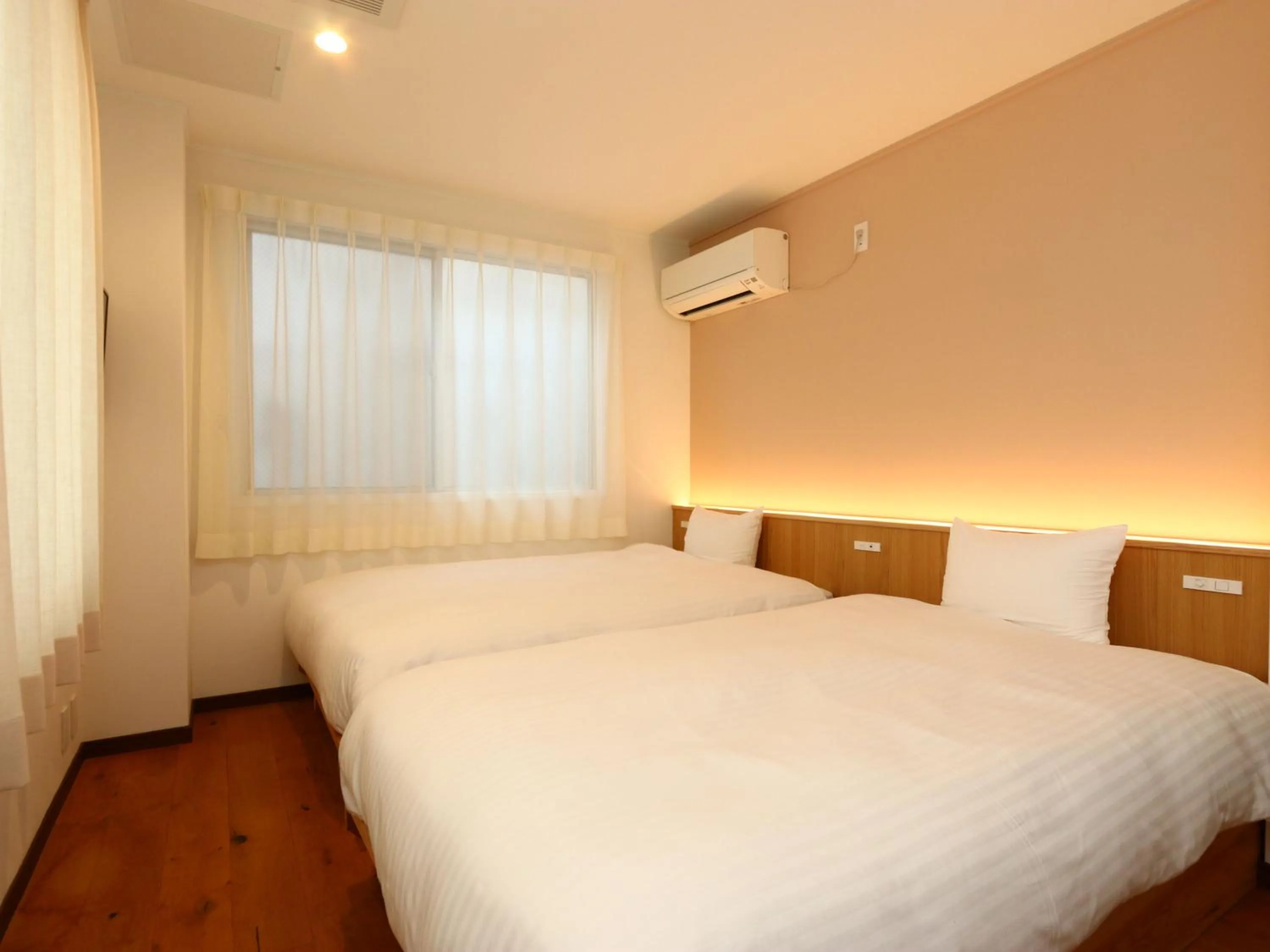 Bed in nirasakiyaSTAY