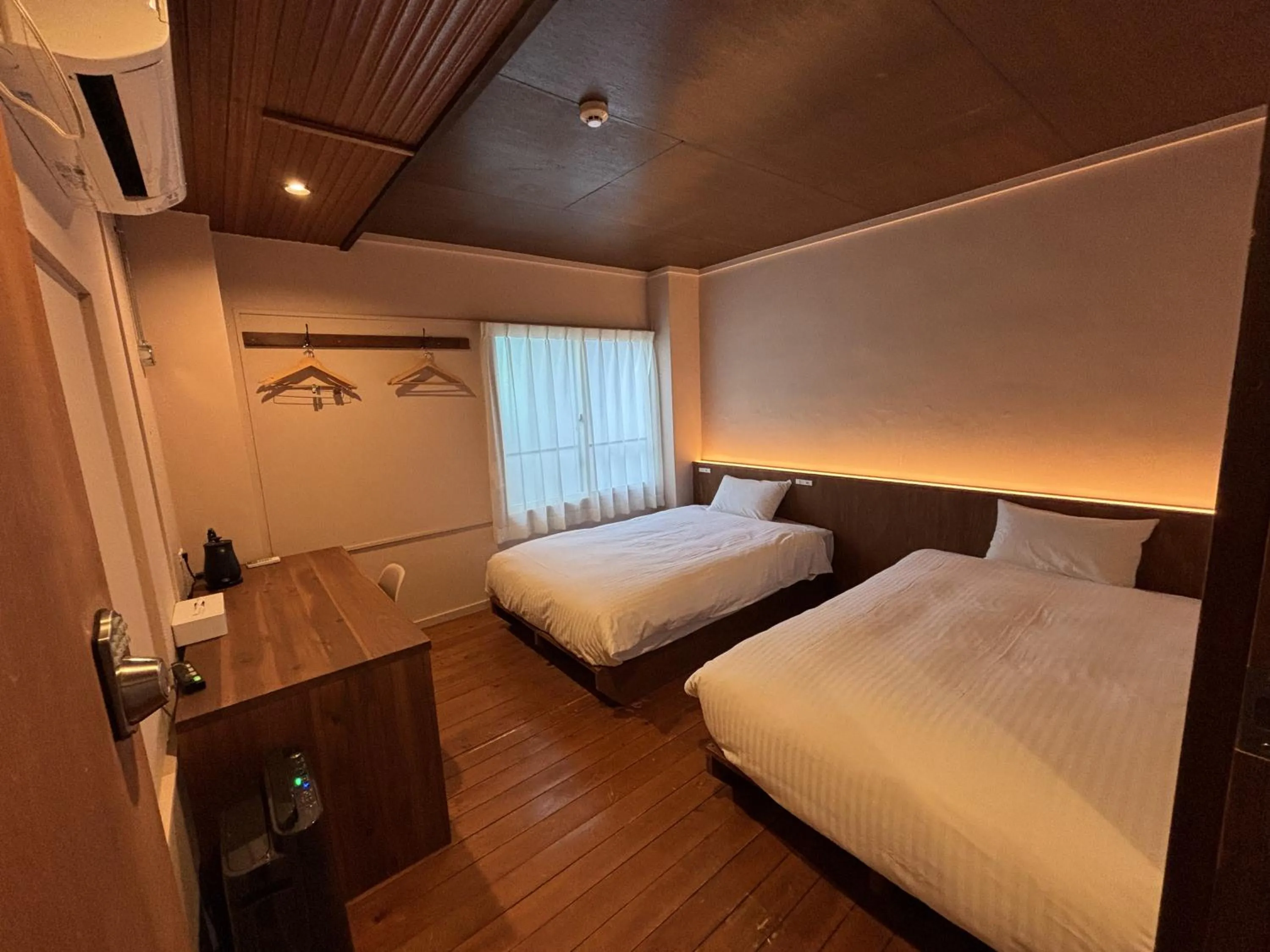 Bed in nirasakiyaSTAY