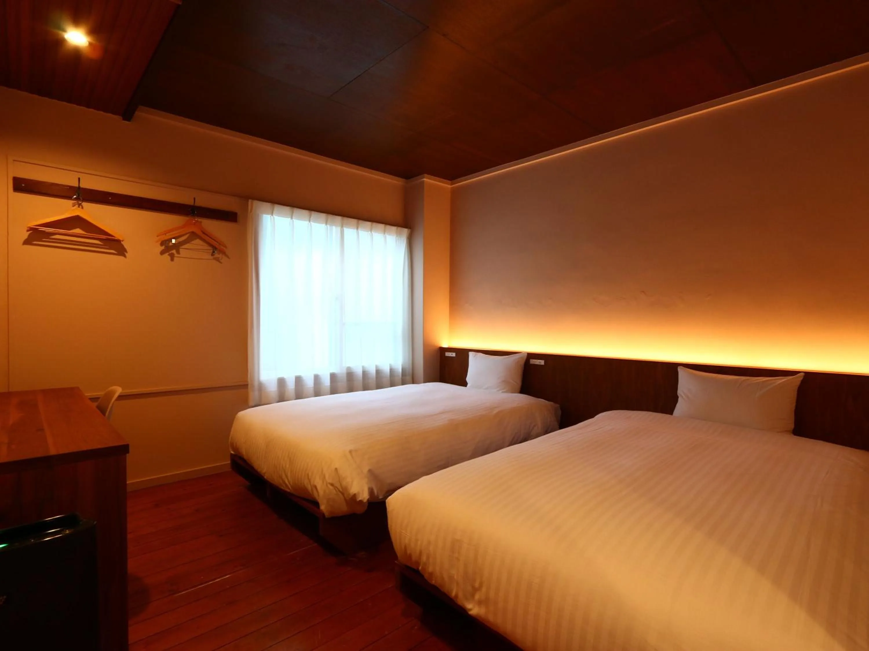 Bed in nirasakiyaSTAY