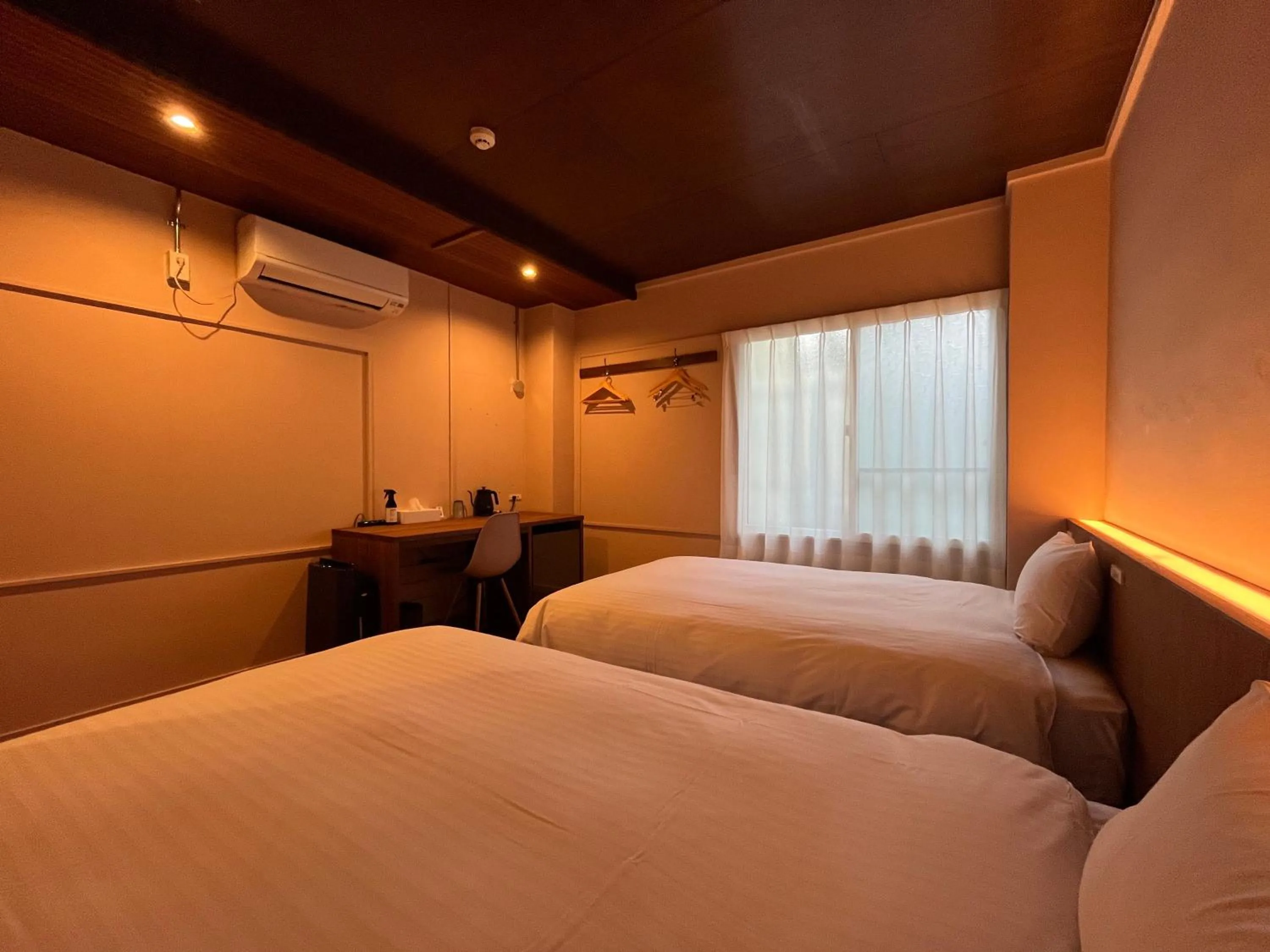 Bed in nirasakiyaSTAY