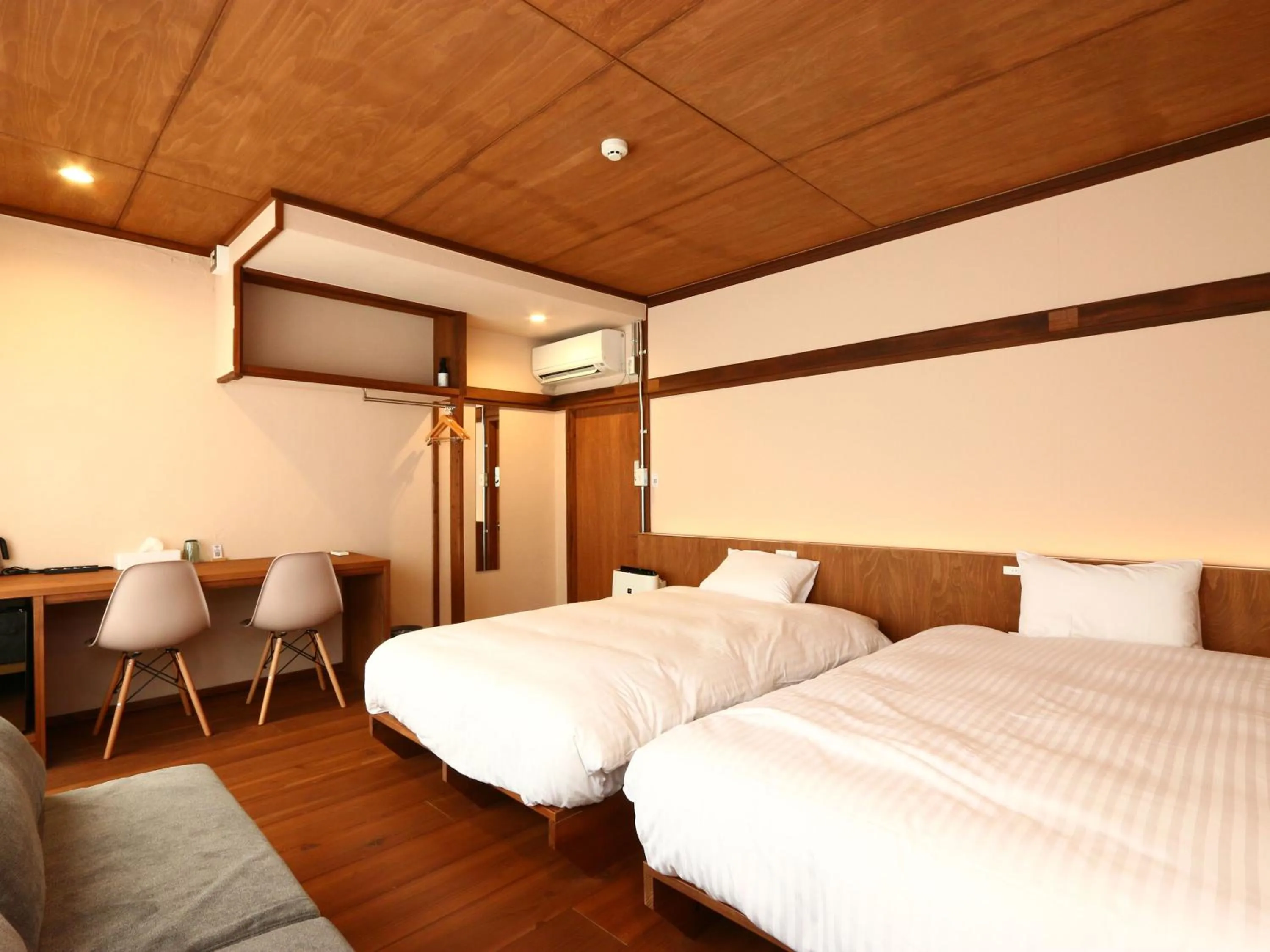 Bed in nirasakiyaSTAY