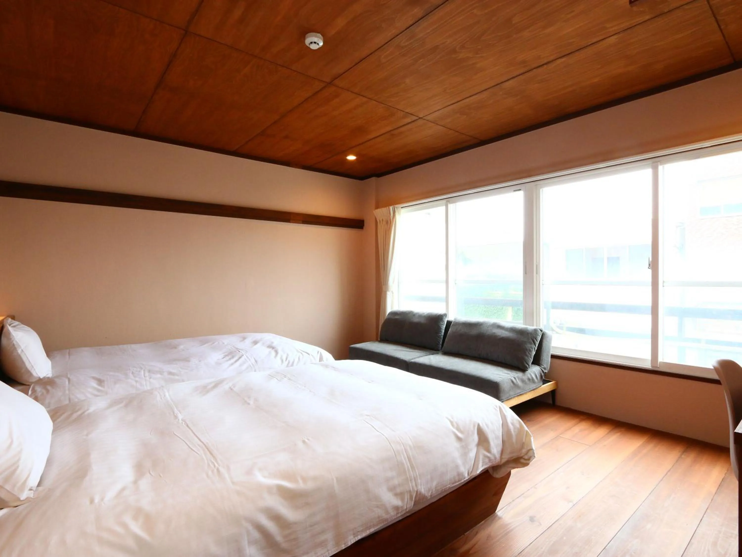 Bed in nirasakiyaSTAY