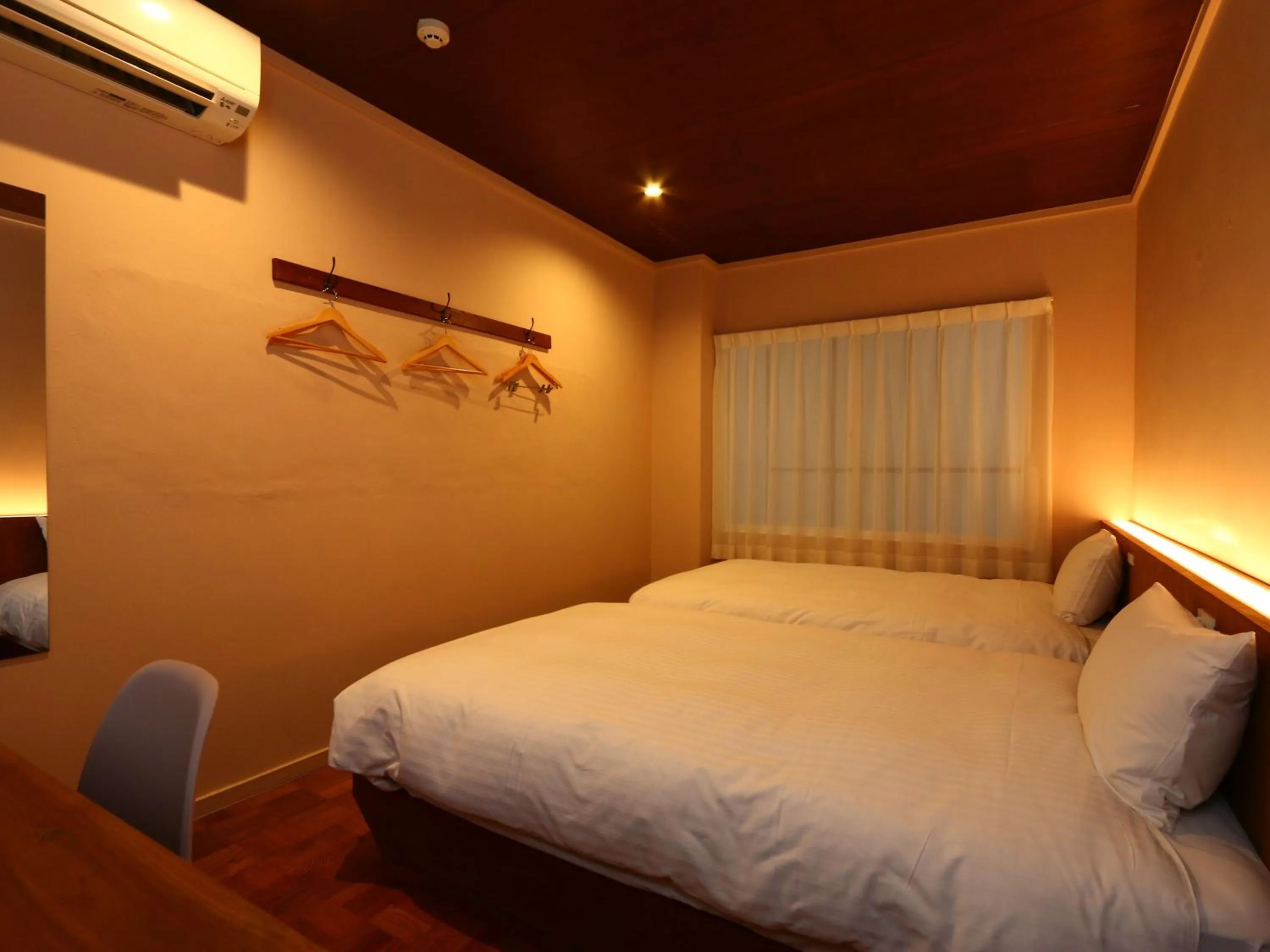 Bed in nirasakiyaSTAY