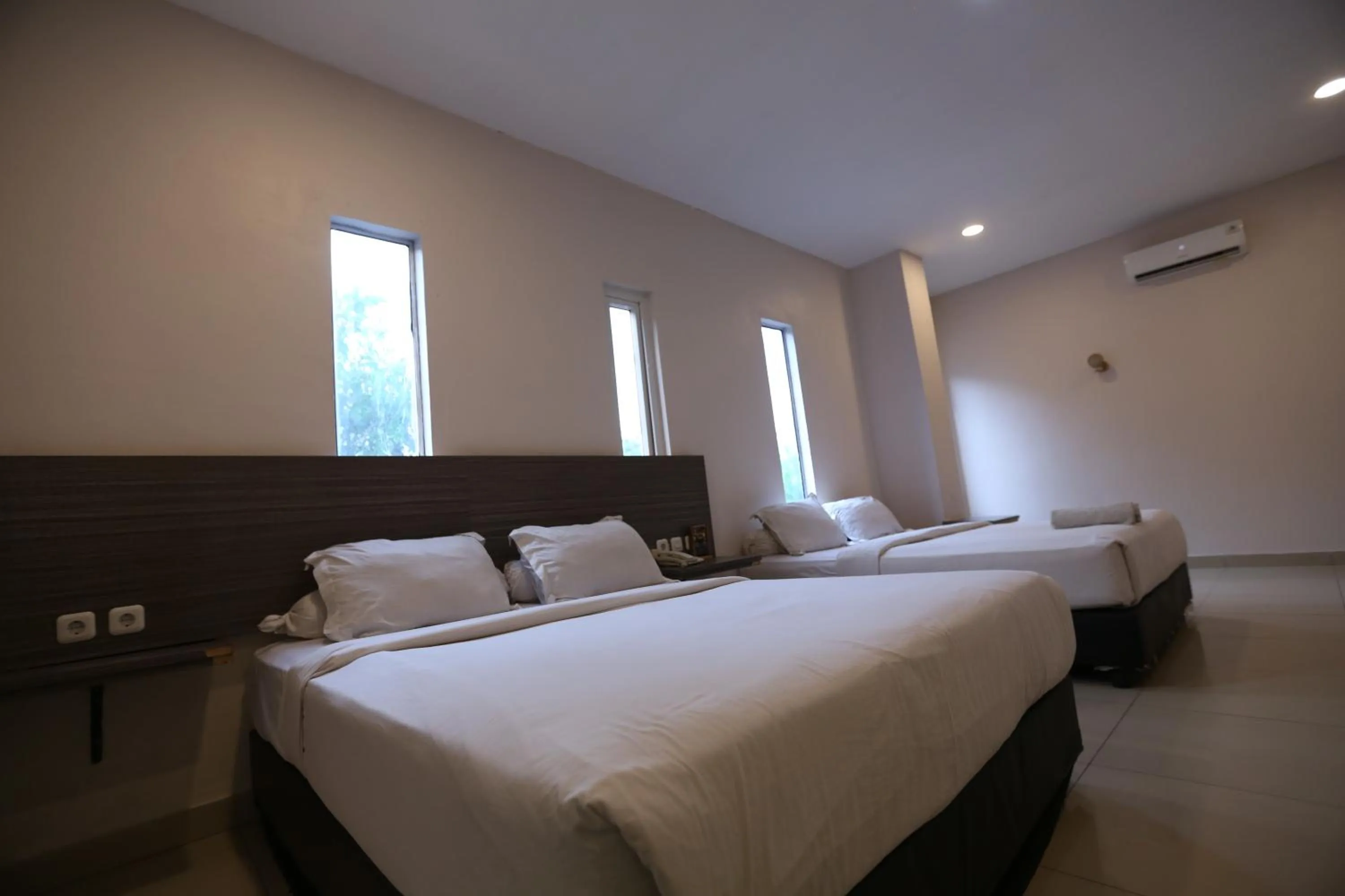 Bed in De'Tonga Hotel