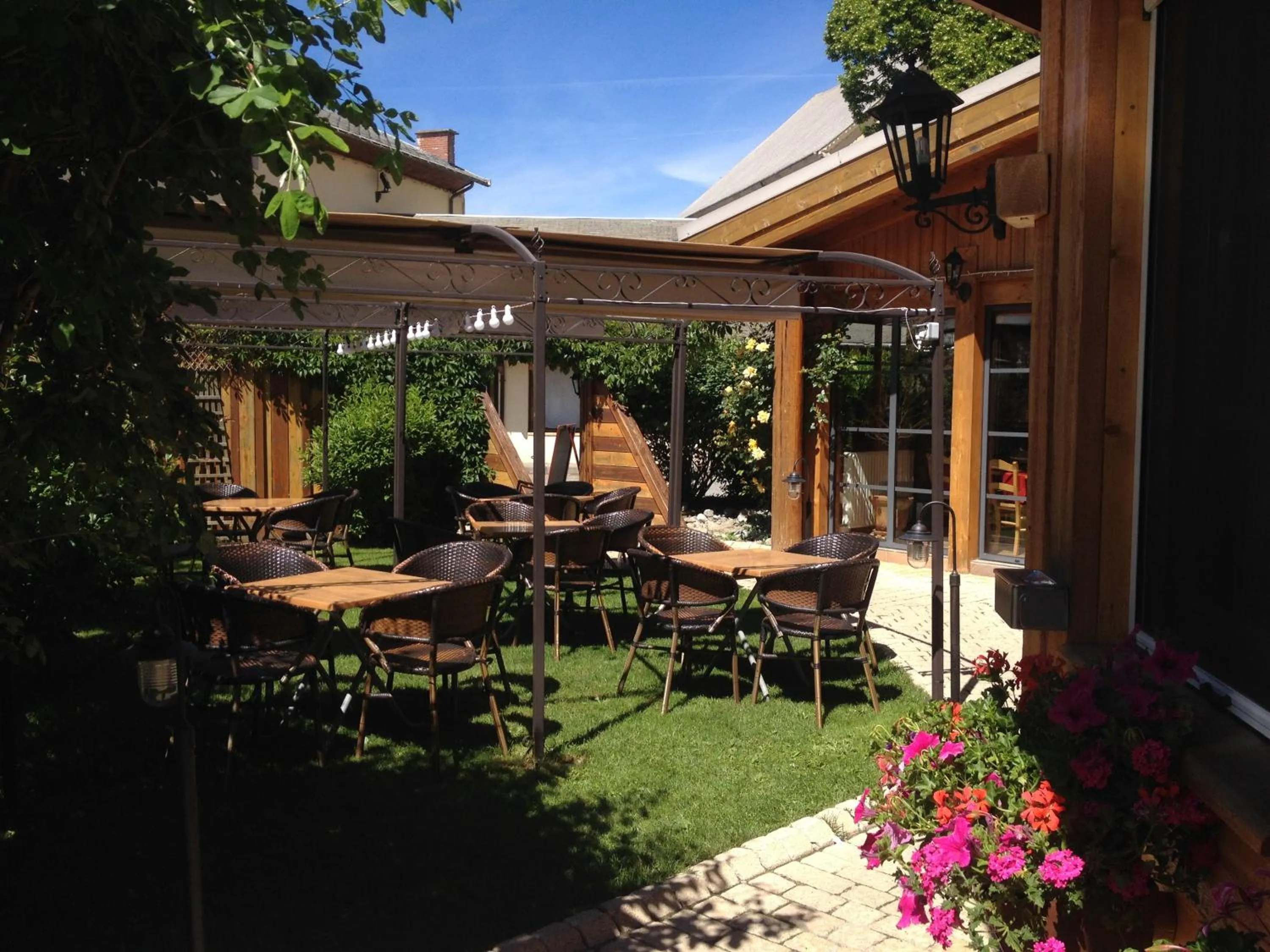 Patio in Logis Hôtel & Spa Les Autanes