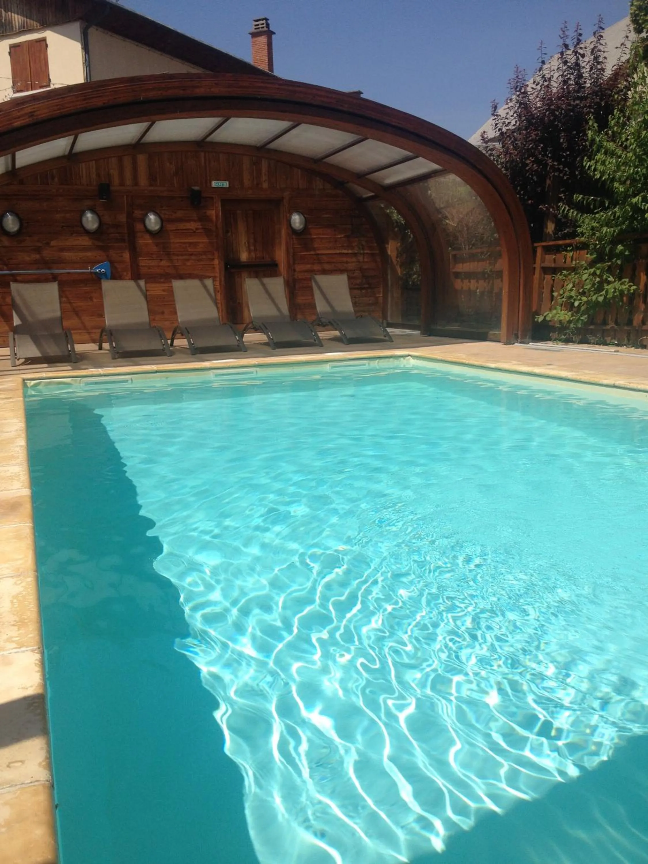 Swimming pool in Logis Hôtel & Spa Les Autanes