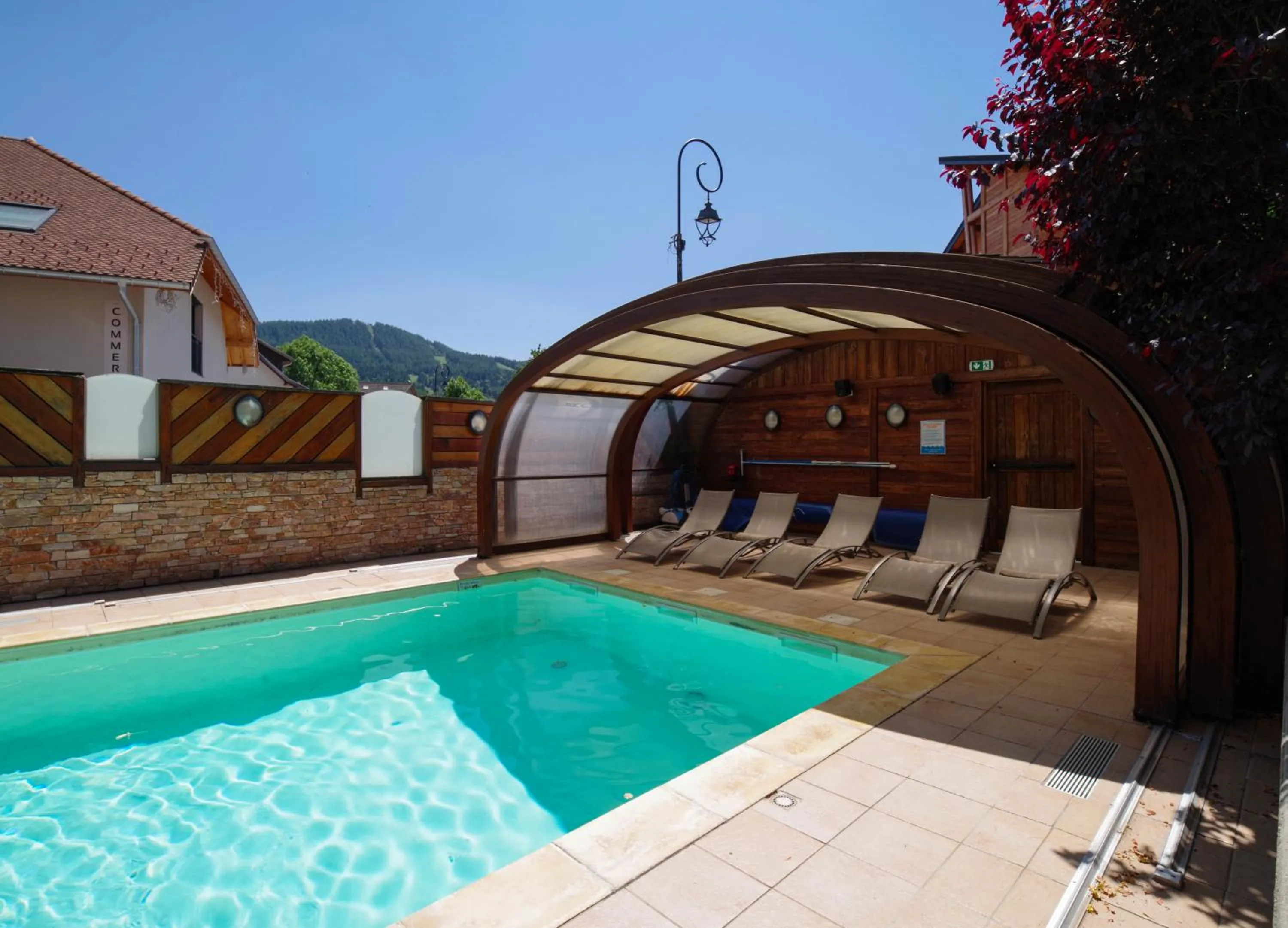 Swimming pool in Logis Hôtel & Spa Les Autanes