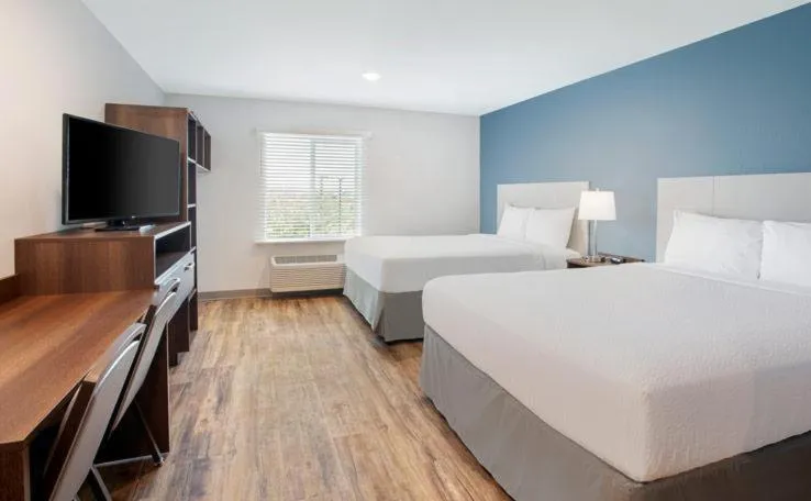 Bed in WoodSpring Suites Lackland near Sea World